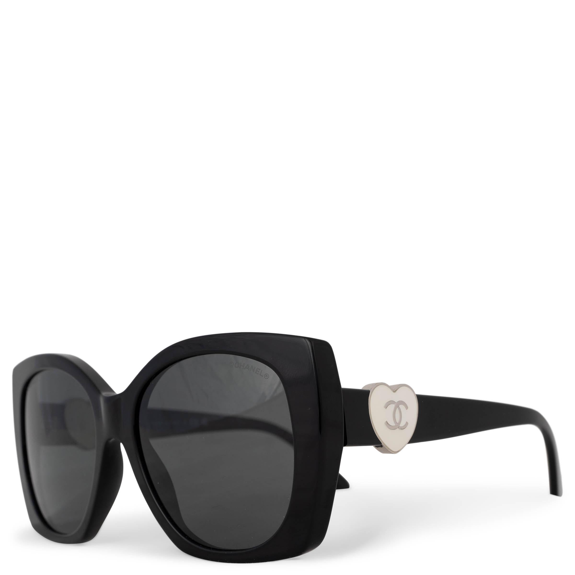 This 100% authentic Chanel sunglasses in black acetate offer a playful yet sophisticated touch. Featuring white enamel heart details at the temples, they bring a charming contrast to the sleek design. Completed with grey square lenses, these