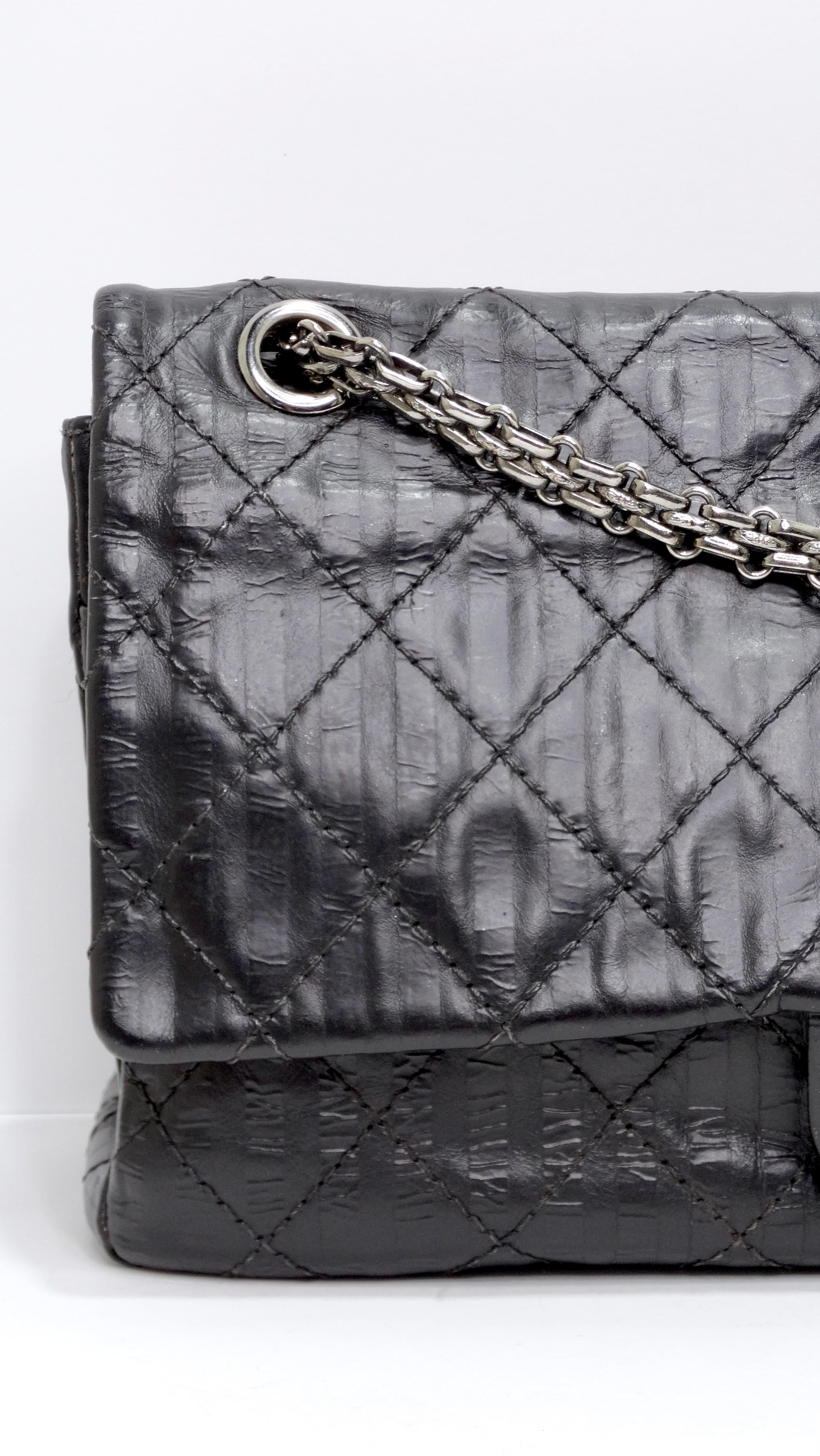 This will be your favorite staple in your closet! You will feel so glam with this gorgeous Chanel Black 2.55 Reissue Quilted Classic Calfskin Leather 225 Flap Bag in a black calfskin leather from a 2008/2009 collection. It is made of crinkled