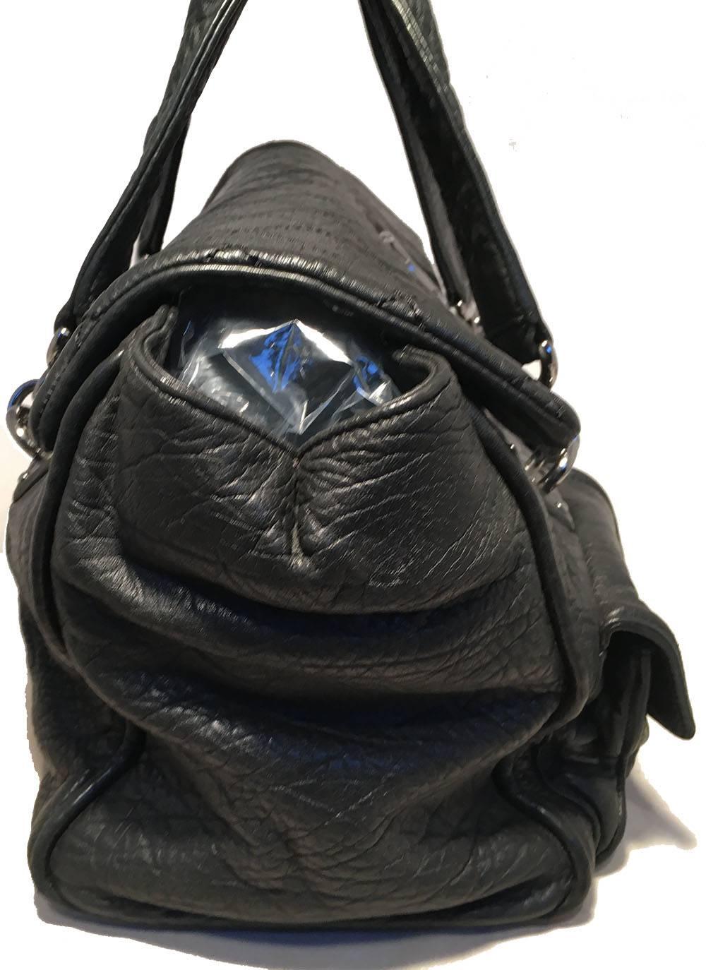 GORGEOUS Chanel Black Aged Calfskin Quilted Classic Flap Tote Bag in excellent condition. Black aged calfskin exterior trimmed with silver hardware. 2 Front exterior small flap pockets for added storage. Double padded leather handles for added
