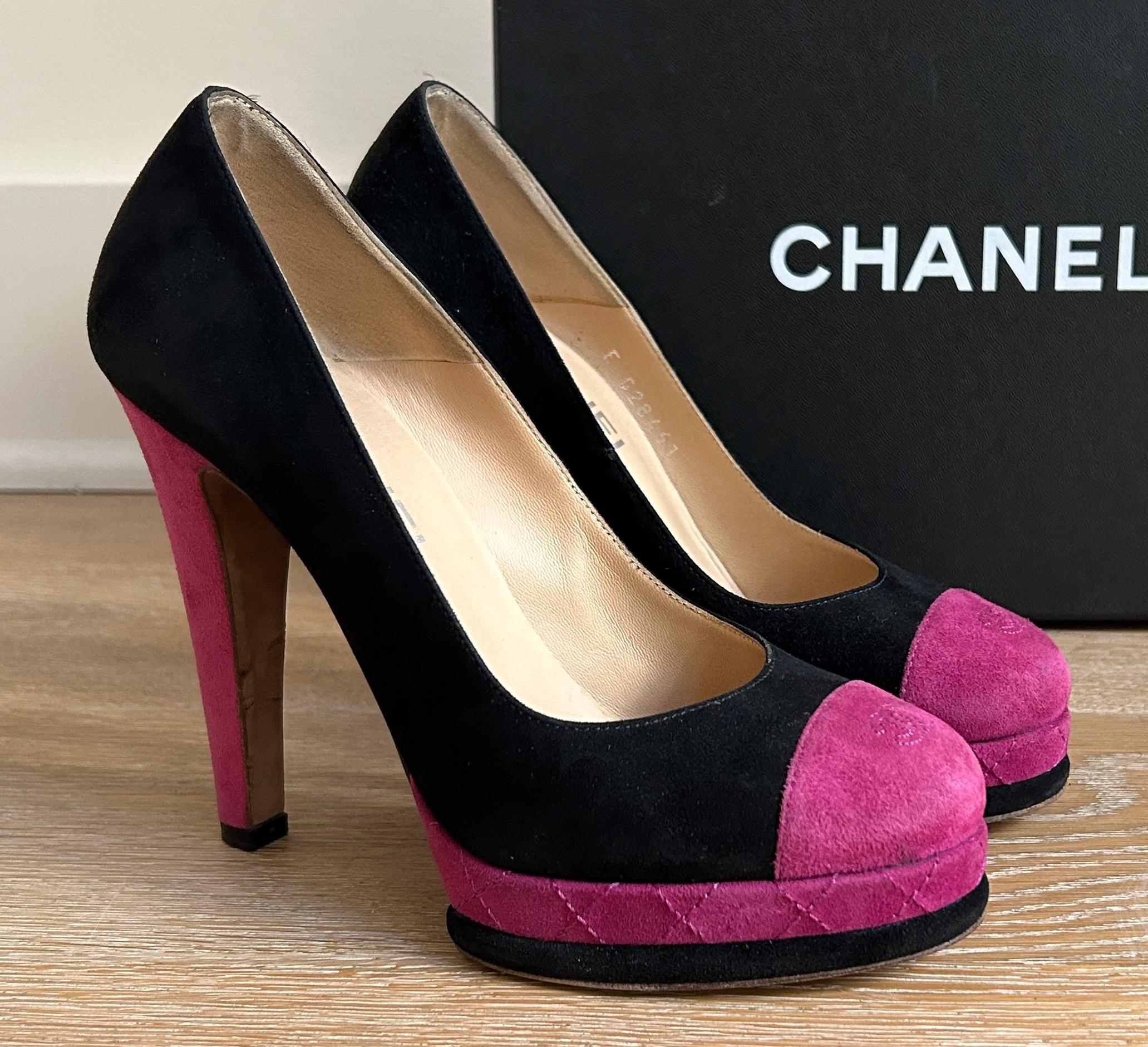 Chanel suede pump in the classic contrast cap toe design in deep fuchsia pink and black. Stitched logo detail at toe and quilt-stitch detail at platform. 

Heel measures approximately 4.5