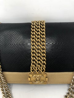 Chanel Schwarze und goldene Boy Bag