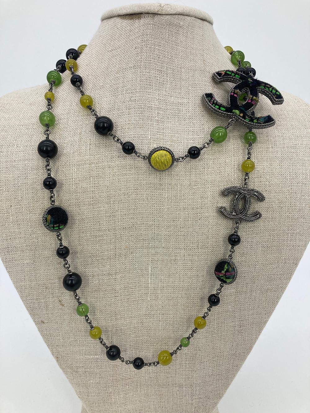 Chanel Black and Green Silver Tweed Beaded CC Logo Necklace- RARE in excellent condition. Black, green and yellow glass beads in various sizes strung together with silver chain and trimmed with tweed beads and CC logos. Largest CC logo features