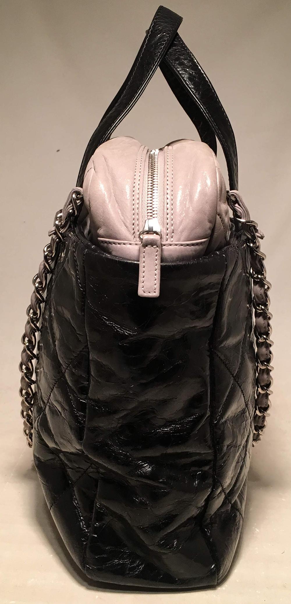Chanel Black and Grey Leather Portobello Tote in very good condition. Distressed quilted black leather with grey shimmery soft calfskin leather top trimmed with double handles and woven chain and leather shoulder straps. Silver hardware trim and CC