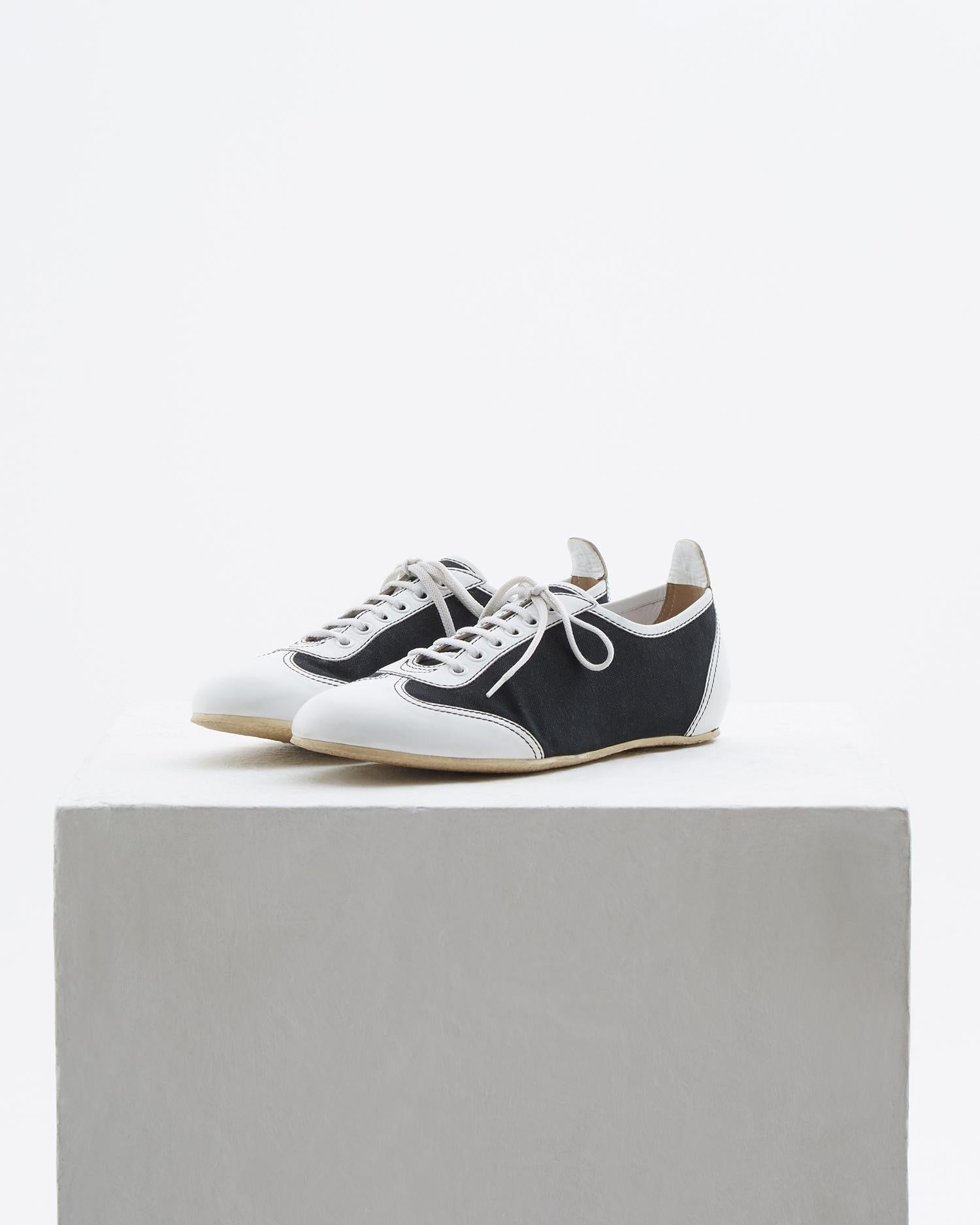 - Designed by Karl Lagerfeld 
- Sold by Skof.Archive
- Black canvas & white leather bowling shoes
- White laces 
- The signature 