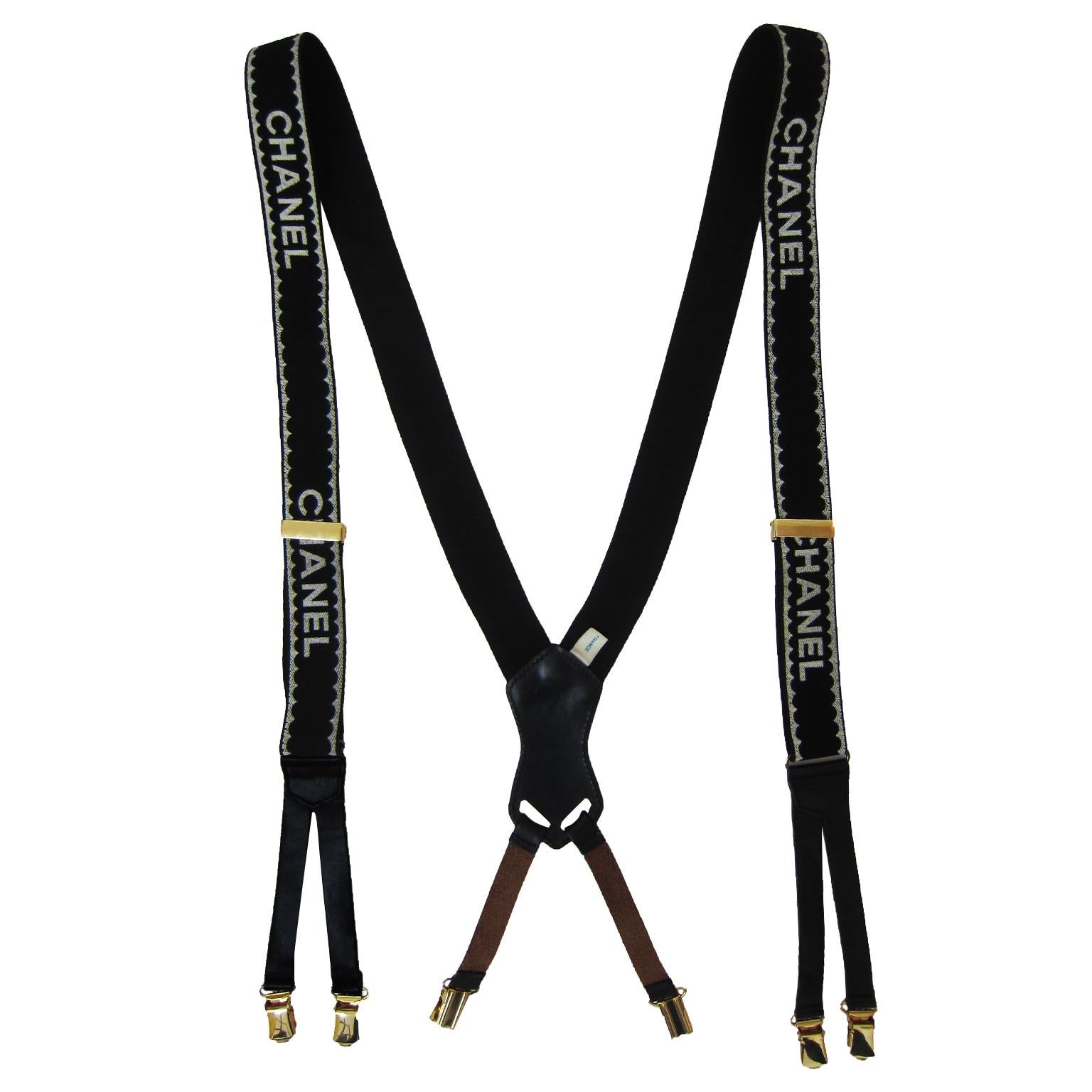 Iconic Chanel suspenders from ss 1994. With gold tone hard wear, black stretch elastic with leather, white Chanel logos. The straps are long and adjustable.
Made in France tag, in original box.