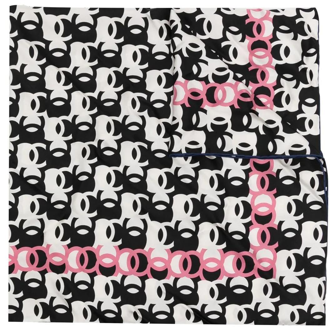 Taking inspiration from the 60s, this abstract Chanel silk scarf displays the brands iconic CC logo in a fun black, white and red pattern. Drape around your neck or loop through the handles of your favourite tote.

Colour: black/white/