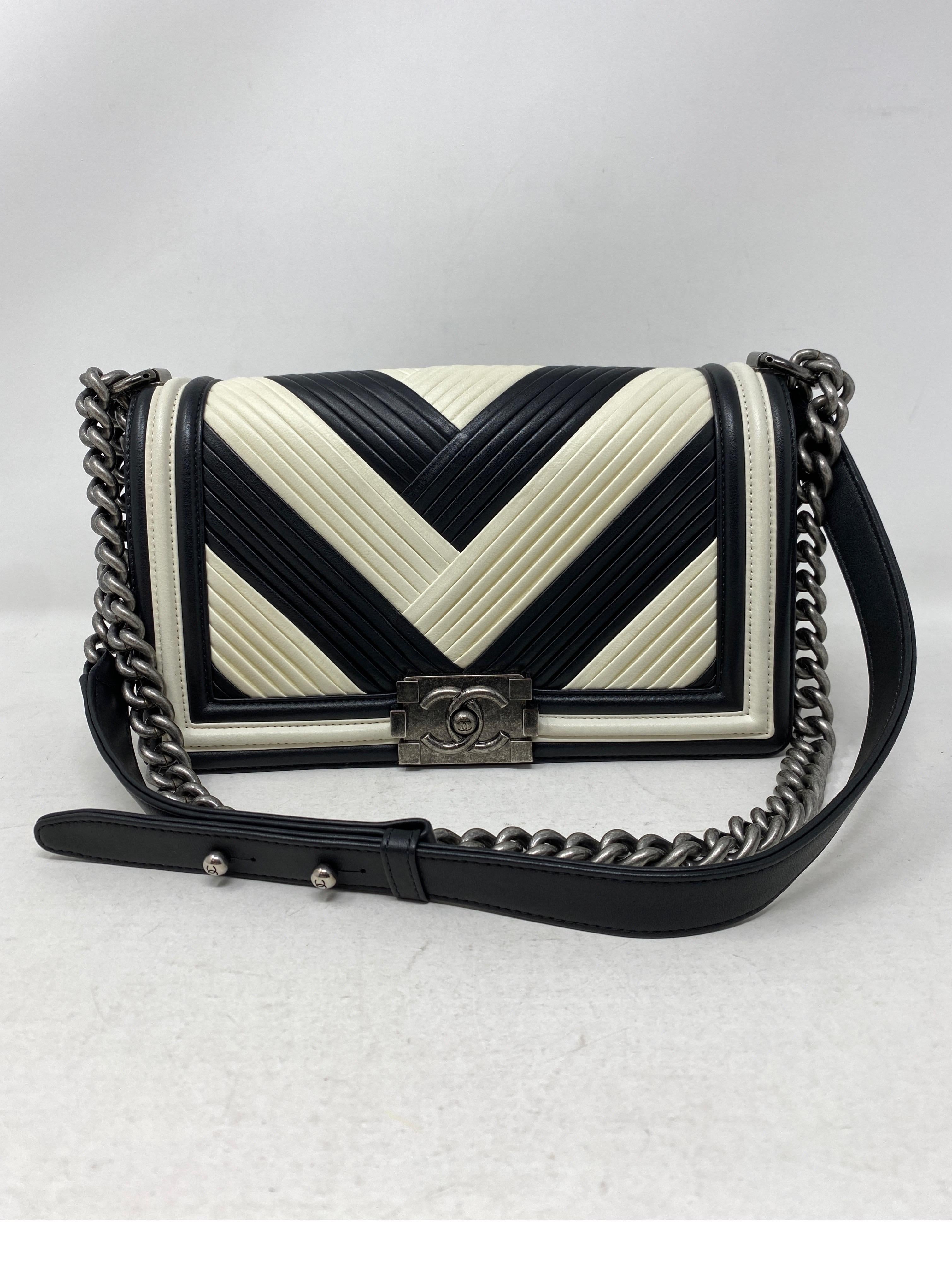 Chanel Black and White Chevron Boy Bag. Ruthenium hardware. Unique pattern and style. Excellent condition. Can be worn crossbody or doubled as a shoulder bag. Includes authenticity card. Guaranteed authentic. 