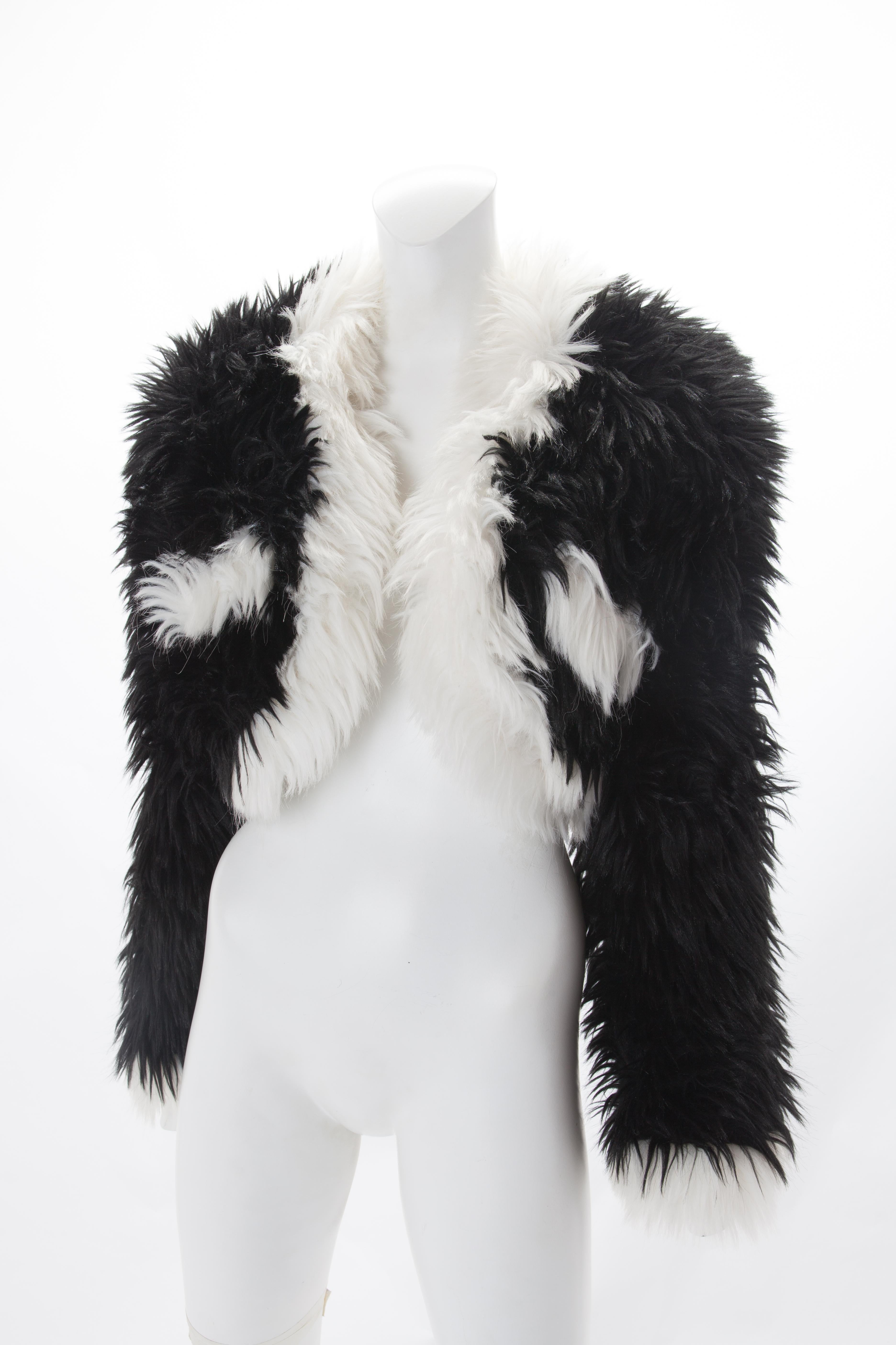 Chanel Black and White Faux Fur Cropped jacket, Fall/Winter 1994.
Black jacket with white accent lapel border and white slanted pockets.
Featuring 