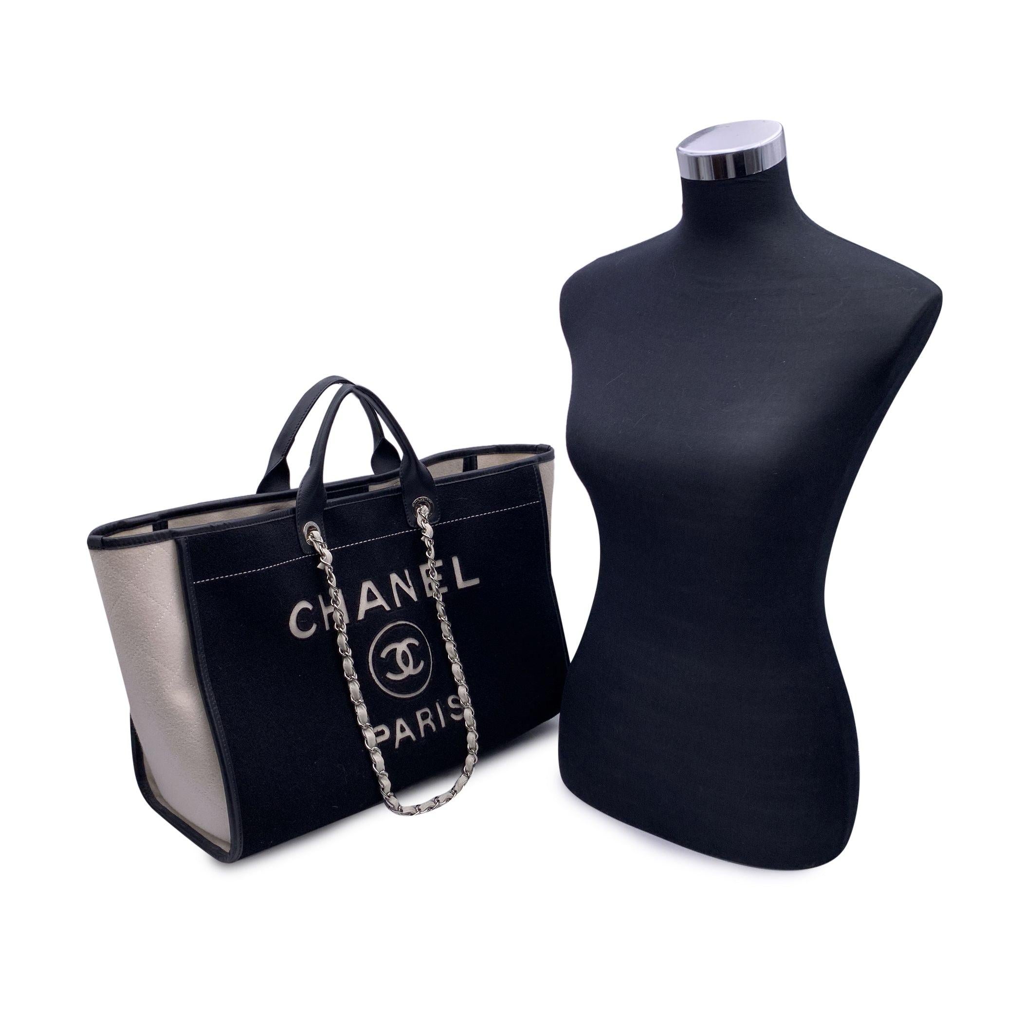 This beautiful Bag will come with a Certificate of Authenticity provided by Entrupy. The certificate will be provided at no further cost. Entrupy for this item at no further cost. Beautiful Chanel 'Deauville' tote, crafted in black and white felt