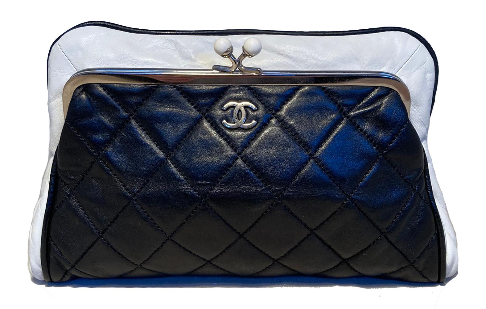 Chanel Black and White Kiss Lock Clutch with Coin Pouch in excellent condition. Black quilted lambskin exterior trimmed with white leather top and side edges and silver hardware. Top kiss lock closure opens to a rose satin interior with one side