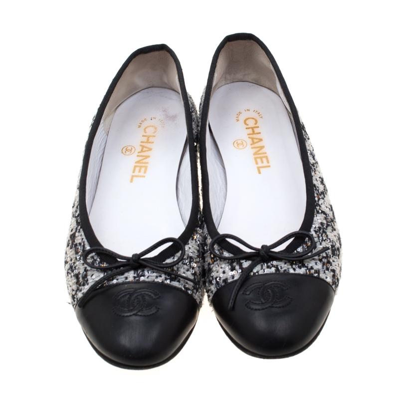 A common sight in the closets of fashionistas is a pair of Chanel ballet flats. They are perfect to wear on an evening out and just stylish enough to assist one's style. These are crafted from black and white tweed and feature bows and the CC logo