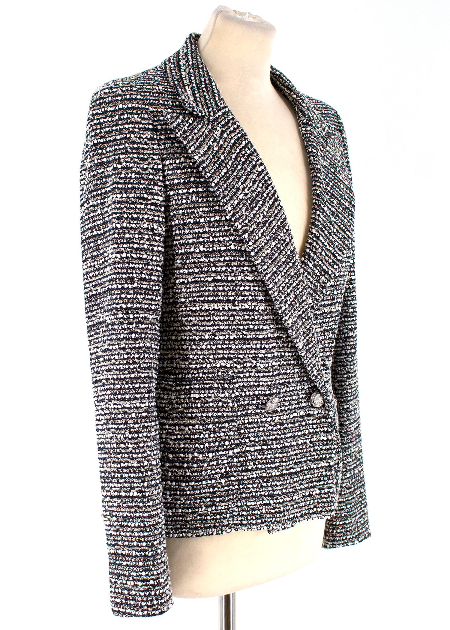 Chanel Black and White Tweed Jacket

-Tweed jacket with silver tone button closure
-Two front pockets
-Notched lapels
-Shoulder pads

Please note, these items are pre-owned and may show signs of being stored even when unworn and unused. This is