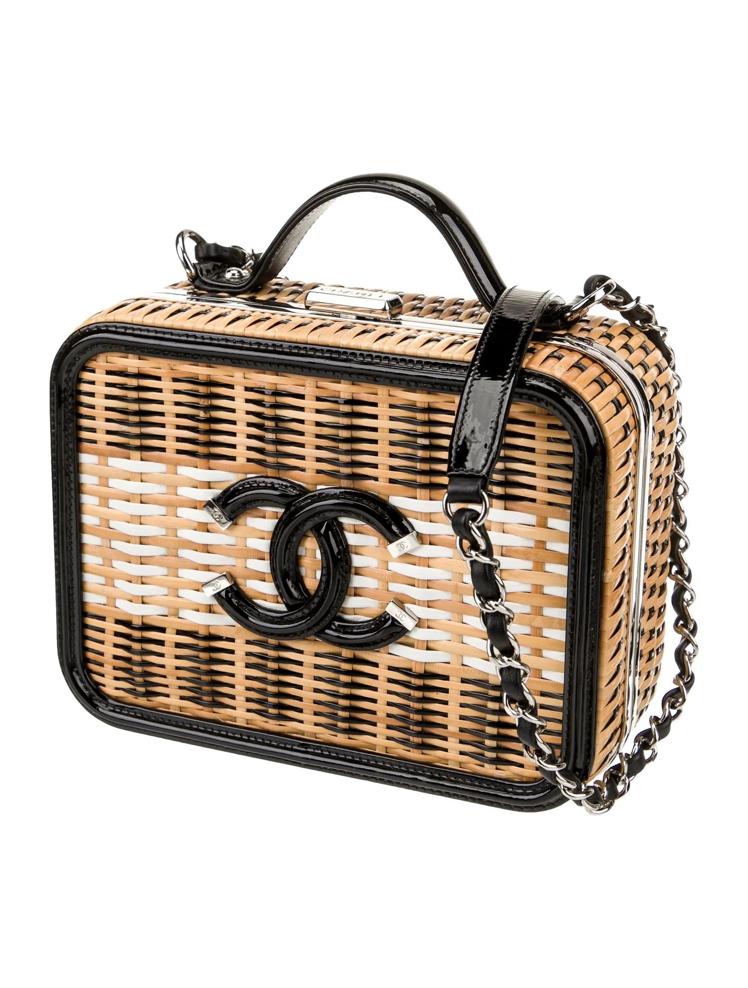 The size is small. The Chanel shoulder bag is from the 2019 Collection by Karl Lagerfeld. It is crafted from brown wicker with a colorblock pattern and silver-tone hardware. The bag features a flat handle and a chain-link shoulder strap, with a