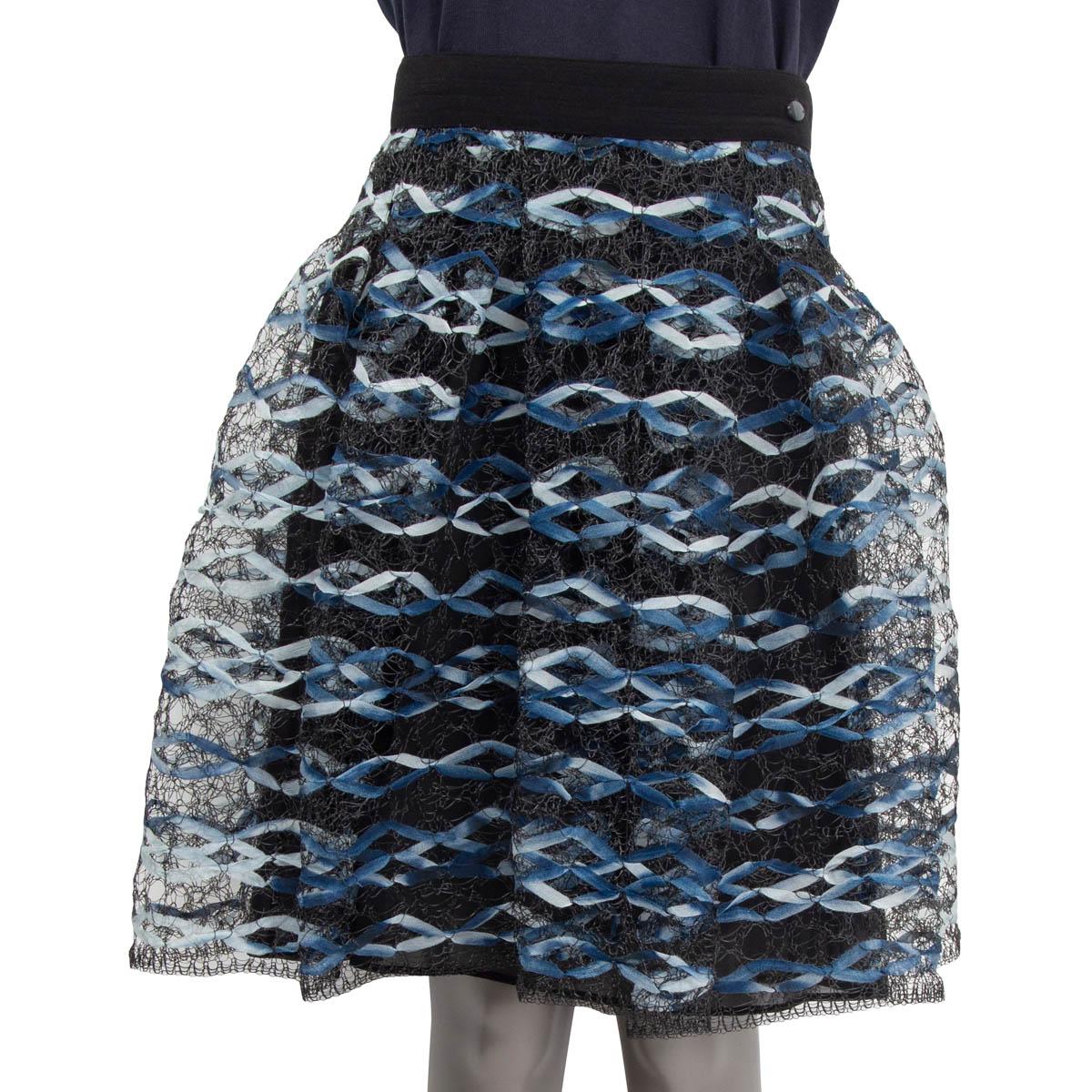 100% authentic Chanel Spring/Summer 2018 fishnet pleated skirt in navy, light blue and white polyester (37%), polyamide (36%) and cotton (27%). Features the 'CC' emblem at the waist. Opens with three push buttons at the back. Comes with a slit skirt