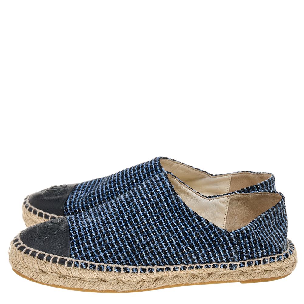 Walk in style and class in these espadrilles from the House of Chanel. They are designed using black-blue leather on the exterior and showcase cap toes and a slip-on style. Trendy and stylish, these espadrilles will surely elevate your trend factor