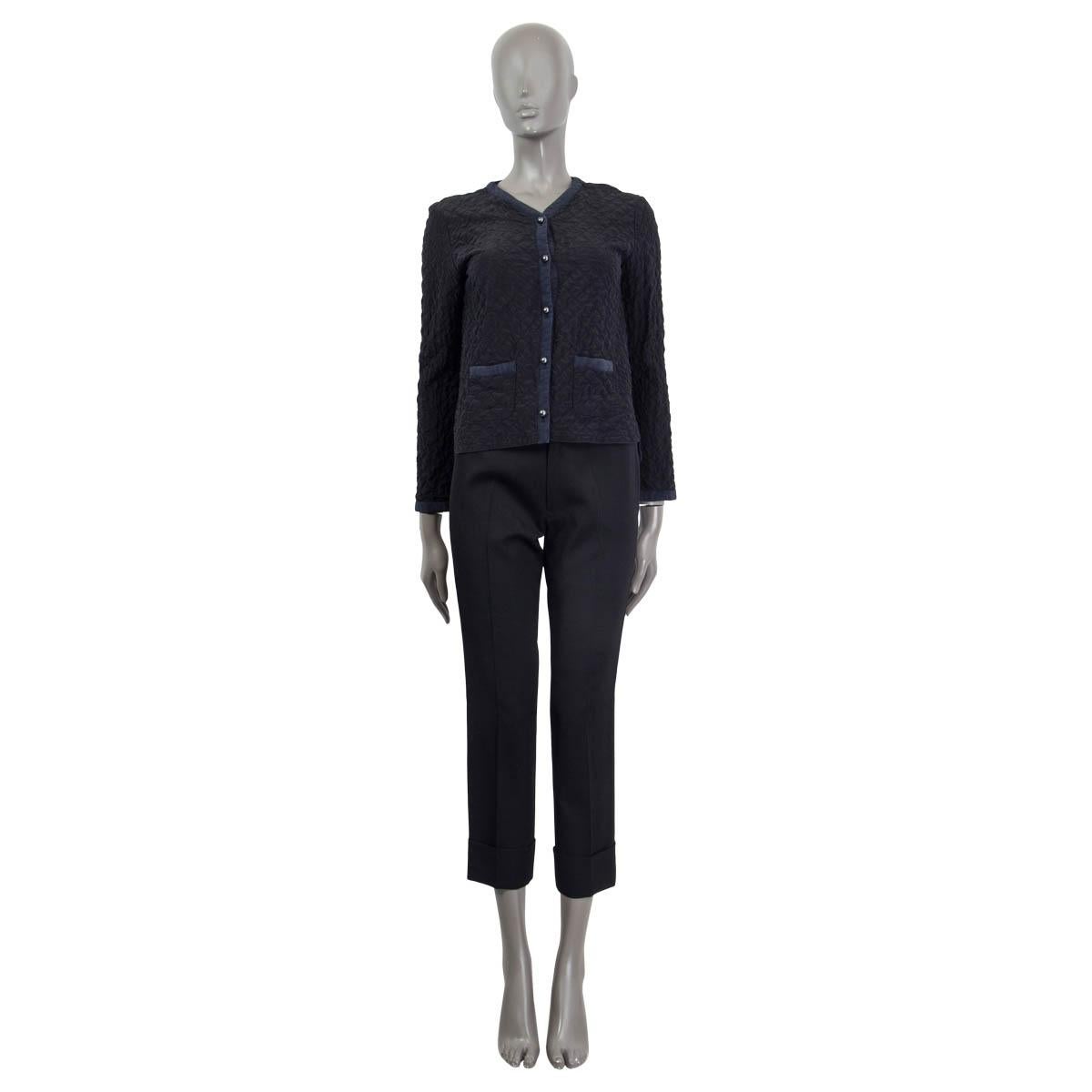 100% authentic Chanel 2015 quilted crepe de chine jacket in black and midnight blue silk (100%). Features two patch pockets on the front. Opens with five 'CC' buttons on the front. Unlined. Colors washed out, otherwise in excellent