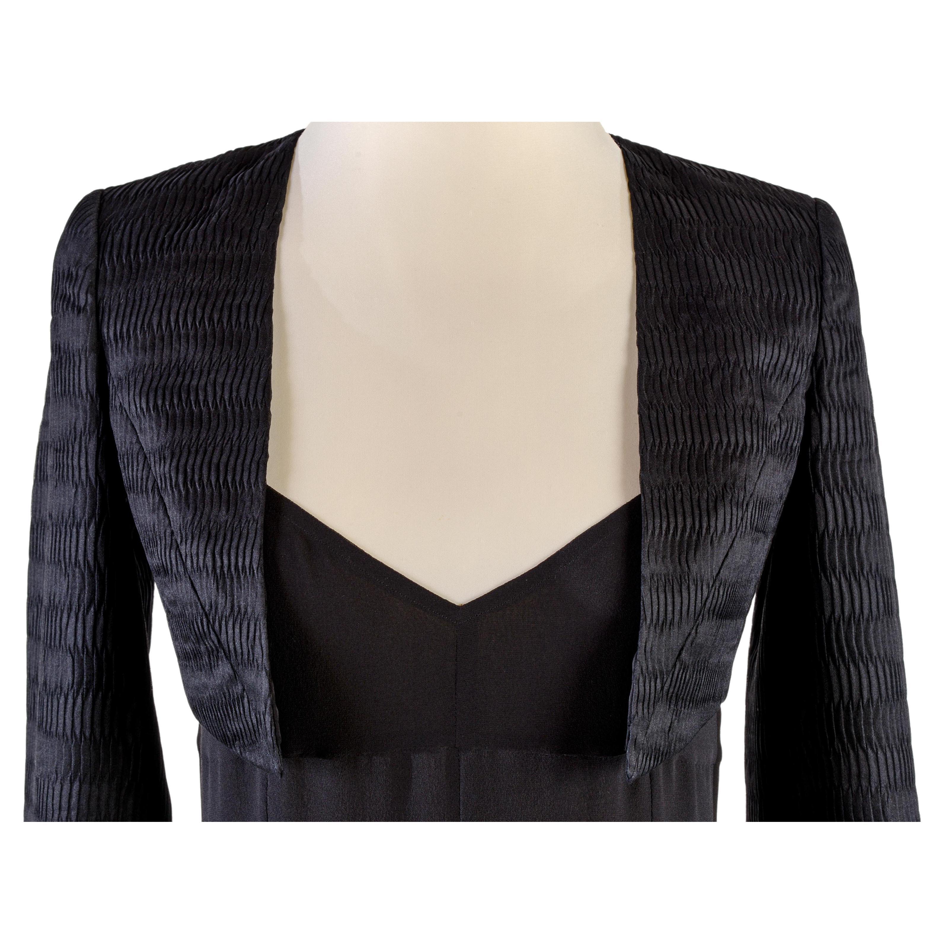 CHANEL Spring 2009  -  Look 49/71 on the show                          
Black bolero jacket
Size FR 36
Made in France
56% polyester
25% silk
19% acrylic
Lining 100% silk
Flat measures:
Length cm. 32                 
Shoulders cm. 35         
Bust