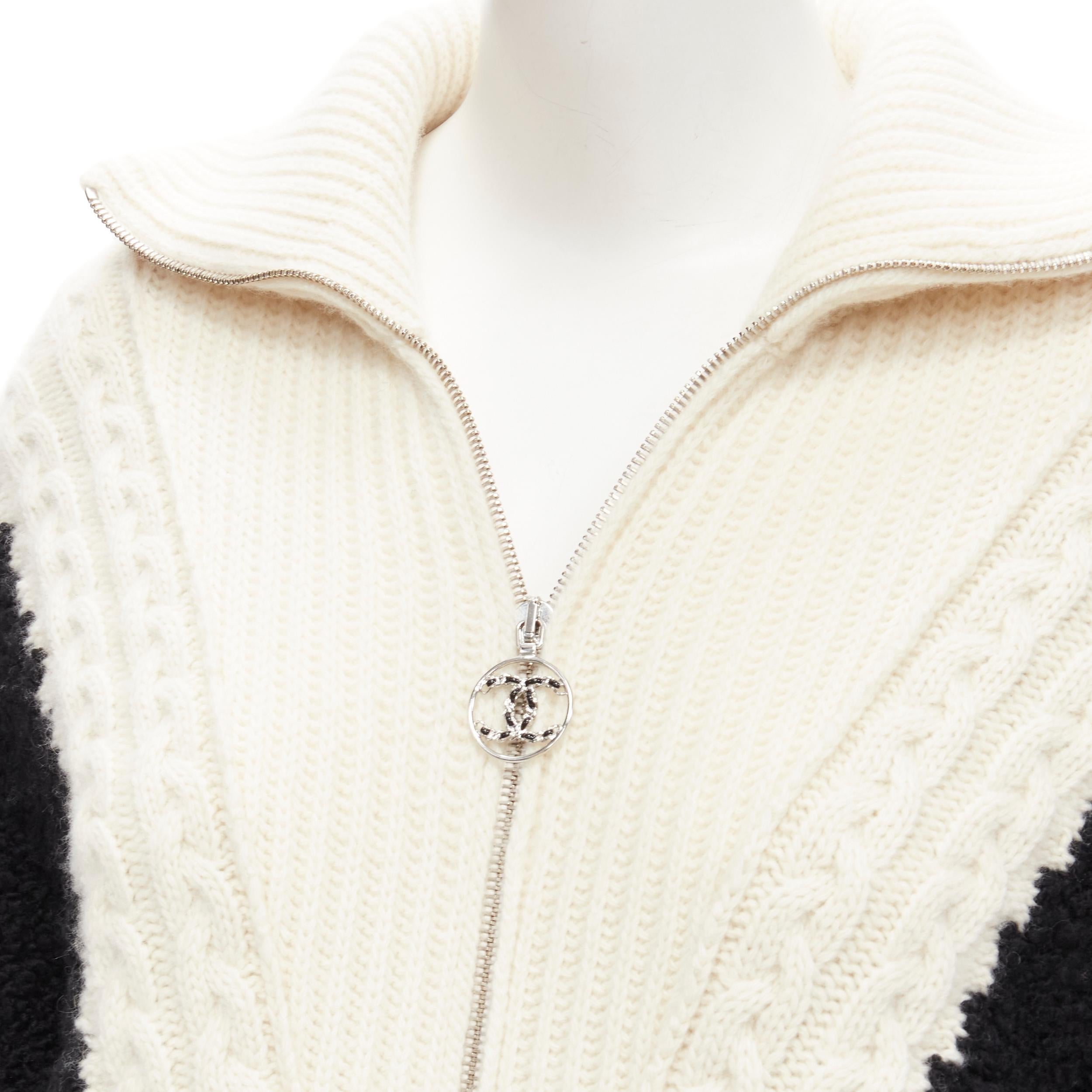 CHANEL black boucle cream cable knit faux layered cardigan jacket FR34 XS
Brand: Chanel
Material: Wool
Color: Black
Pattern: Solid
Closure: Zip
Extra Detail: Designed to look like a jacket was worn over a turtleneck knit. Cream chunky cable knit.