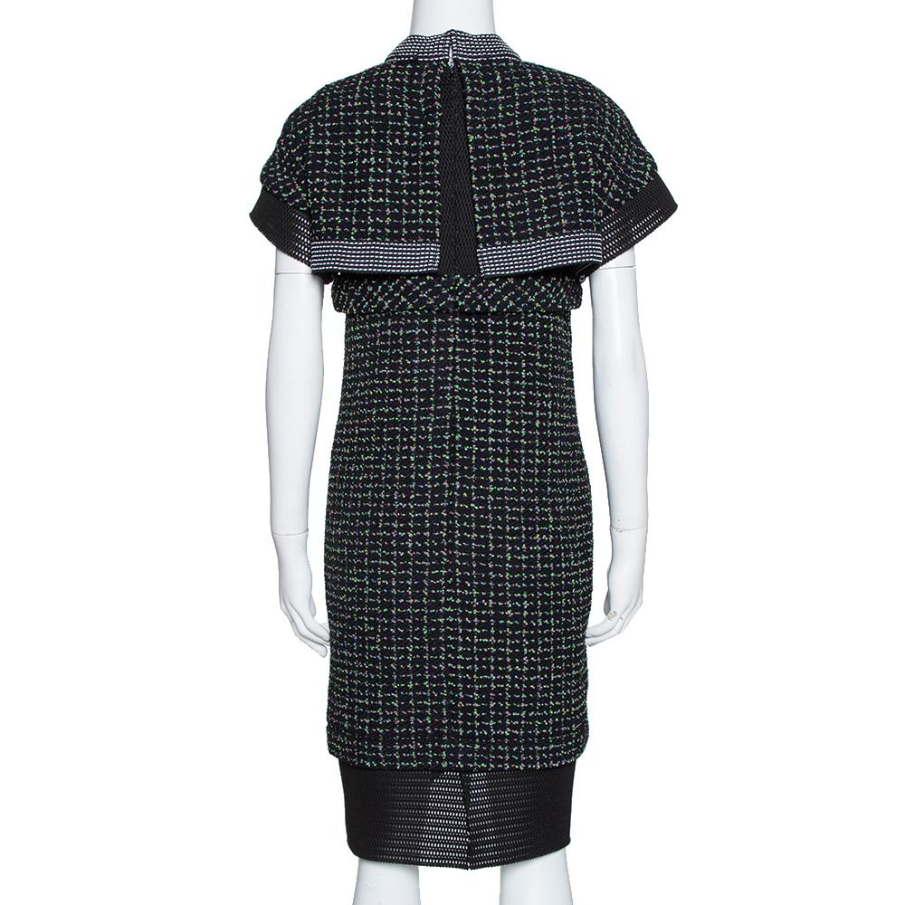 This Chanel dress is a piece to be treasured. This short sleeve design is made from knit fabric and mesh, and elegantly draped to flatter the figure. Team with strappy sandals and a chain wallet for a slick and elegant look.