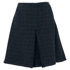 CHANEL Black Bouclé Wool A-Line Skirt with CC Button - FR 48