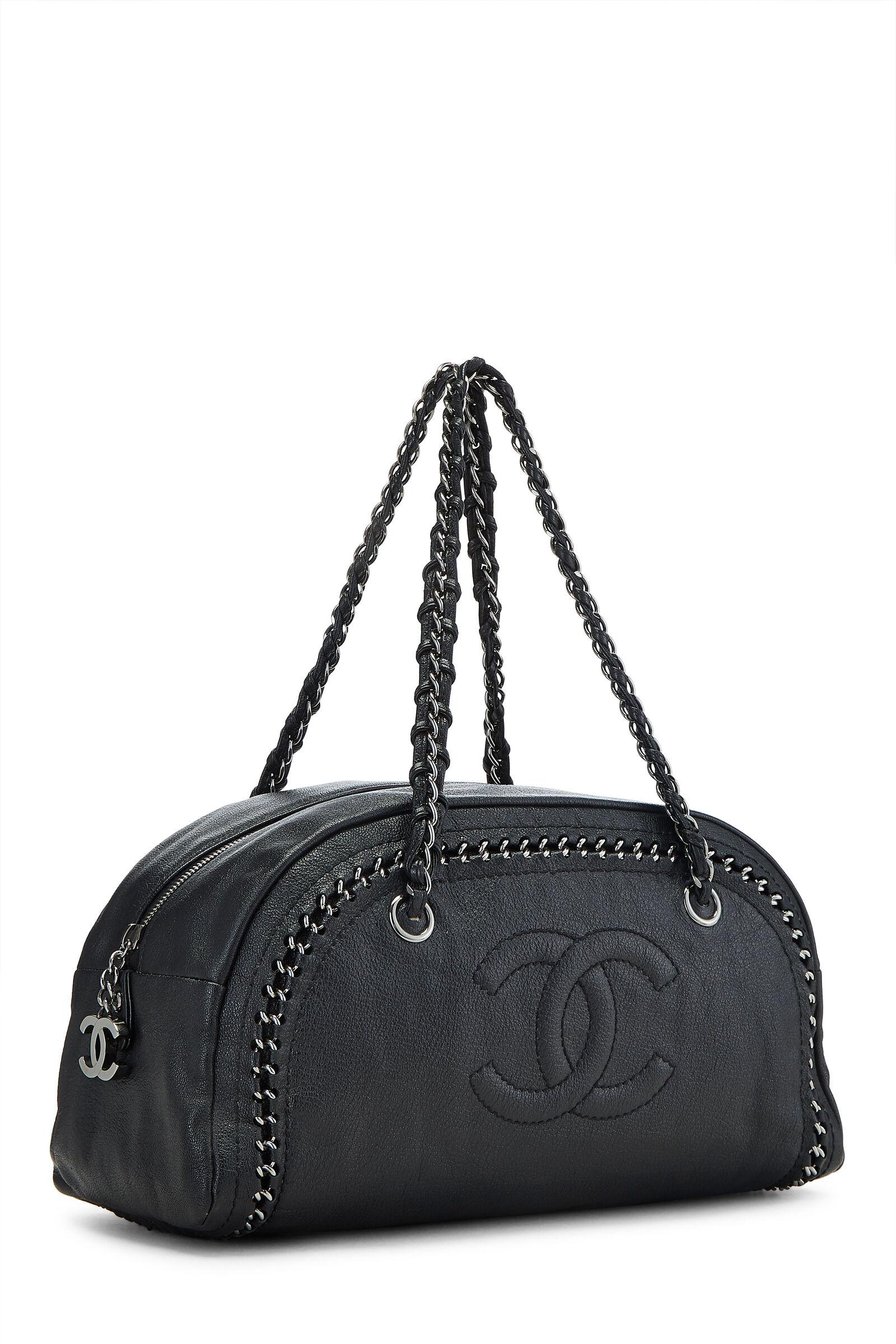 Chanel Black Bowling Bag Luxury Ligne Leather Lambskin Medium Satchel

Two Woven Chain-link And Leather Handles
Zip-around Closure
Interior Zip And Two Slip Pockets
Leather
Leather Lining
Gunmetal Hardware

Made in France