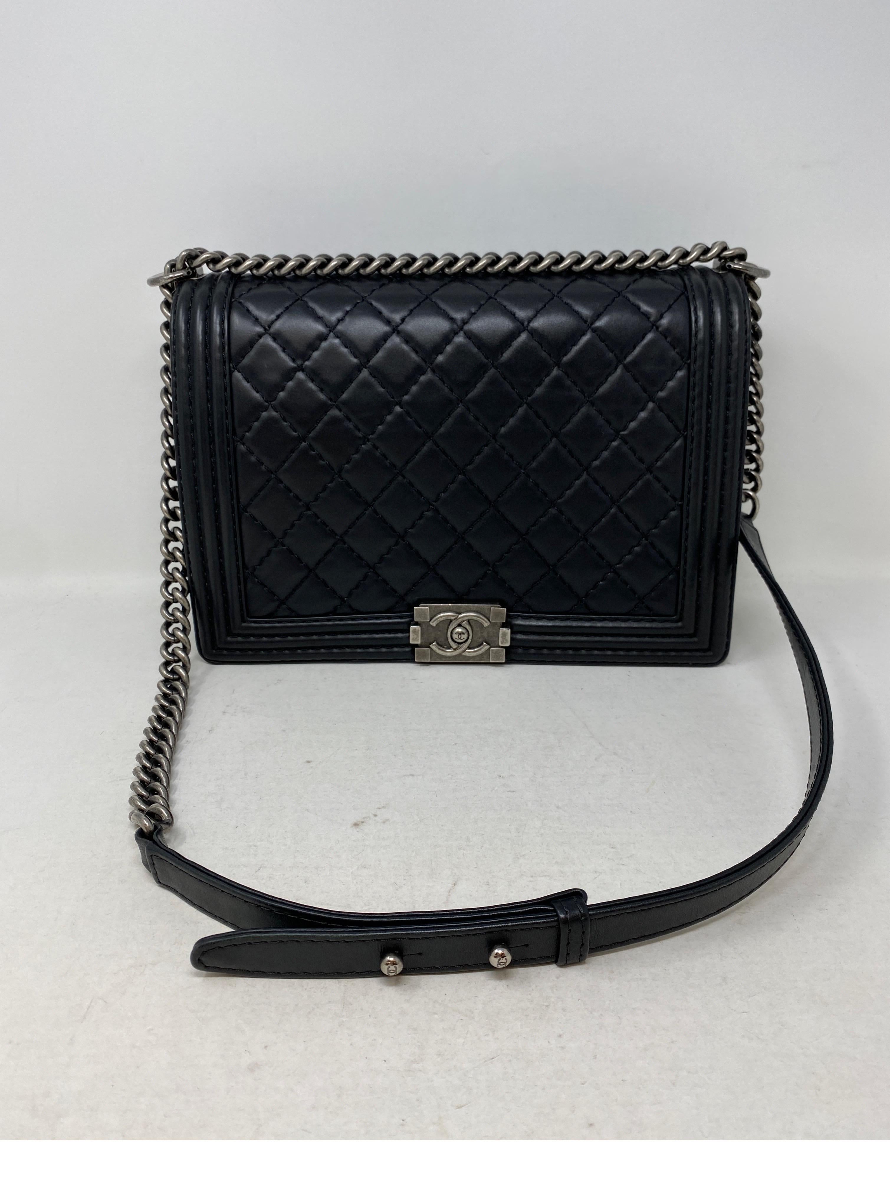 Chanel Black Boy Bag. Large Black Boy bag. Calf leather with ruthenium hardware. Excellent like new condition. Interior clean. Can be worn as a crossbody or doubled as a shoulder bag. Full set. Includes authenticity card, dust bag, and box.