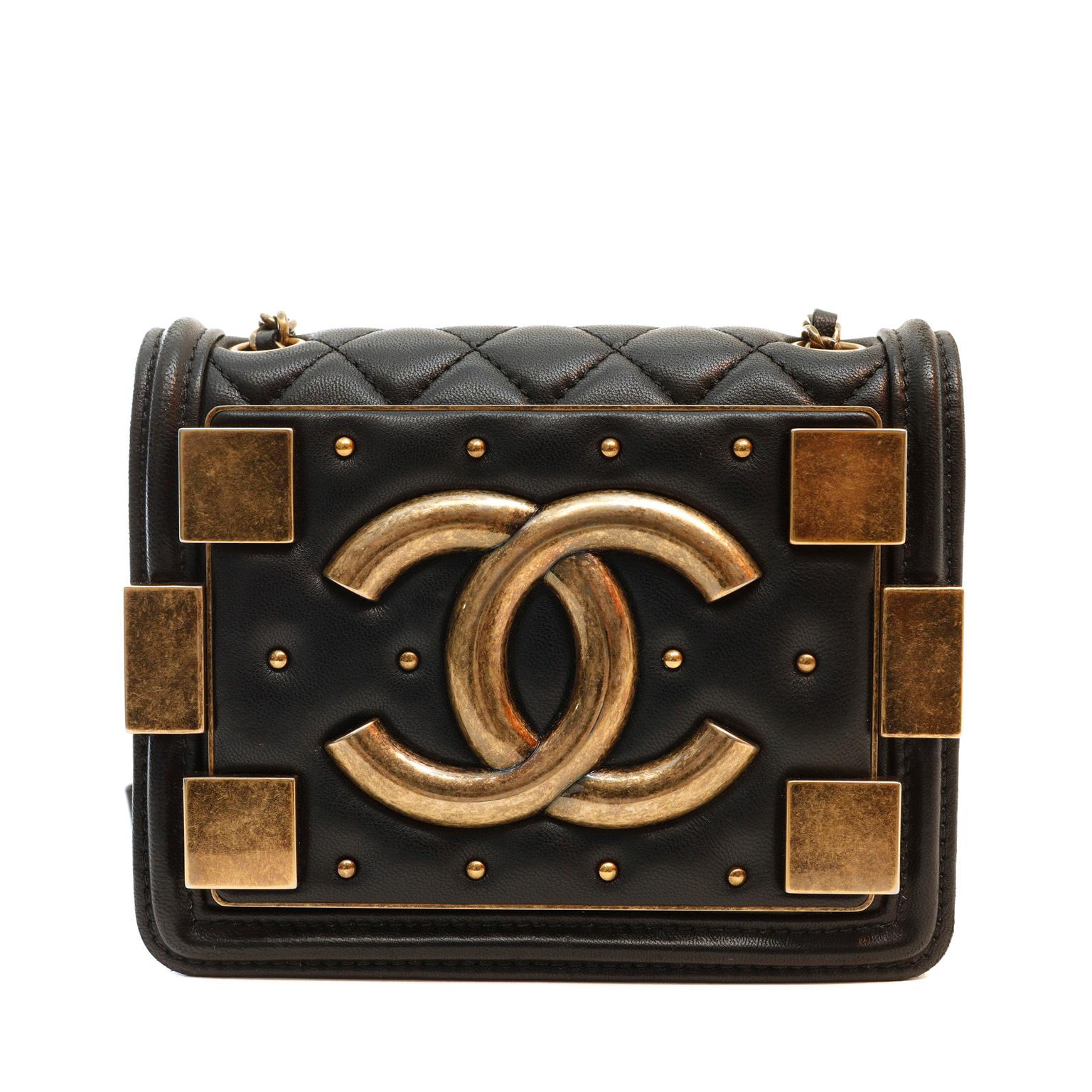This authentic Chanel Black Brick Mini Boy Bag is in pristine condition from the Byzantine Collection; a Runway collectible.  Antiqued gold accents, studs and square hardware give this updated Chanel major edge.  Magnetic snap closure.  Long leather