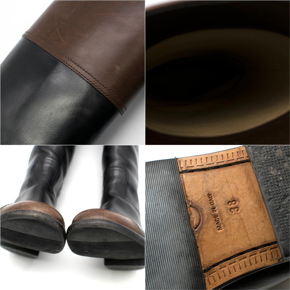 Chanel black and brown leather knee high riding boots size 38

- Leather
- Brown & black colour block
- CC badge on ankle
- Knee high
- Round toe

Please note, these items are pre-owned and may show some signs of storage, even when unworn and