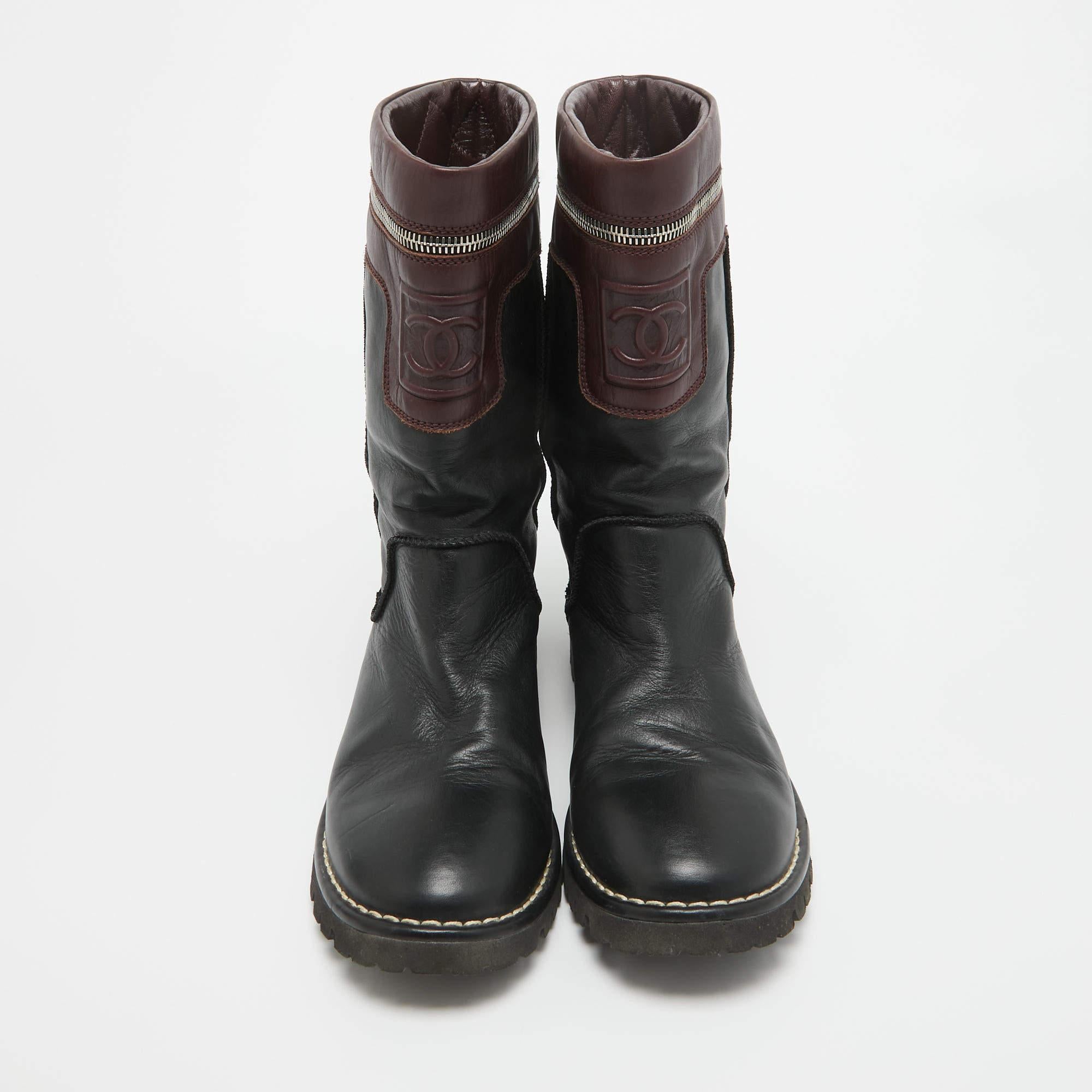 Classy, sturdy, and stylish, these boots from the House of Chanel are all you require to show your luxe fashion taste! They are designed using black-burgundy leather into a mid-calf silhouette. They showcase silver-tone hardware and a slip-on style.
