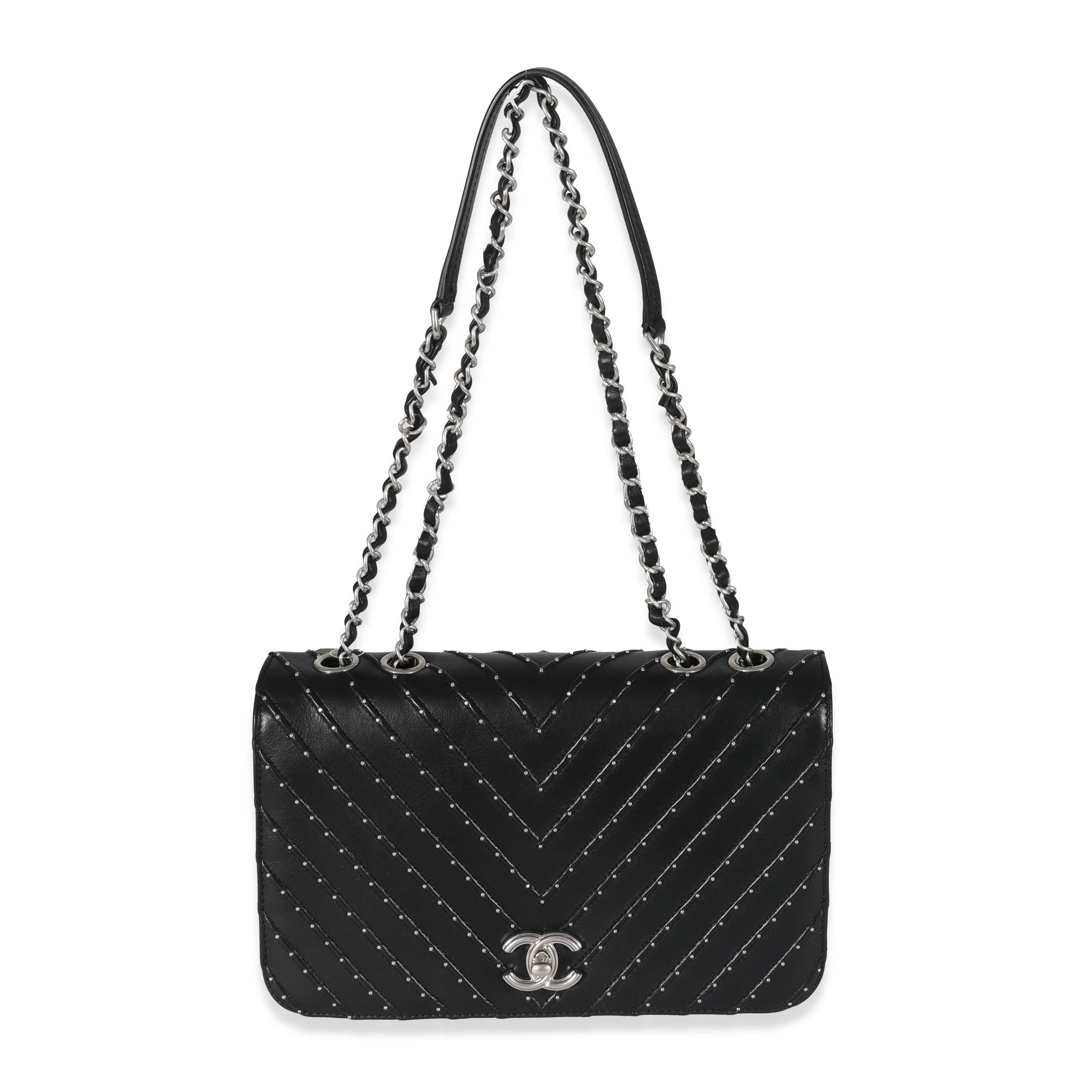 Listing Title: Chanel Black Calfskin Chevron Small Stud Wars Flap Bag
SKU: 130627
Condition: Pre-owned 
Condition Description: A timeless classic that never goes out of style, the flap bag from Chanel dates back to 1955 and has seen a number of