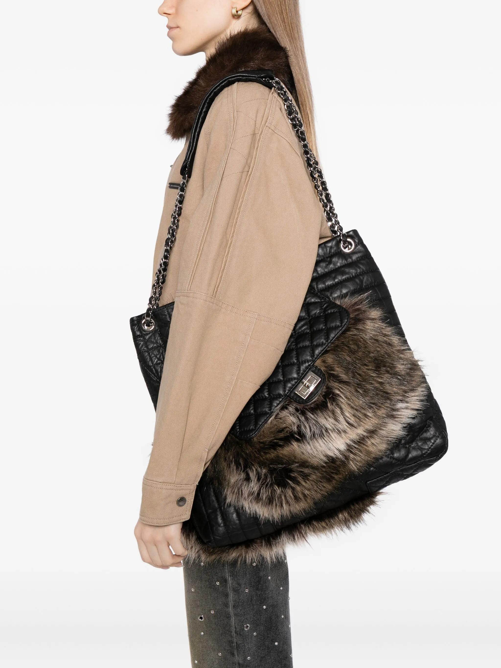 black
concealed magnetic fastening
front buckle fastening
two chain-link top handles
debossed logo to the front
faux-fur detail