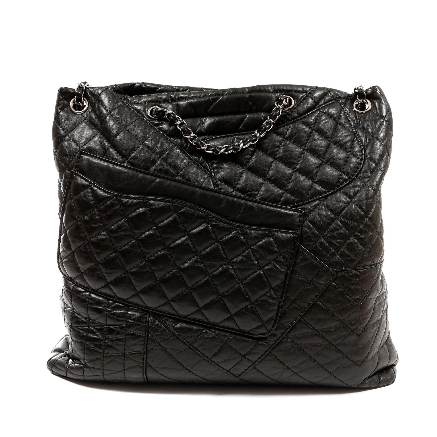This authentic Chanel Black Calfskin Reissue Pocket Tote is in excellent condition. Ultra chic details make this a true standout in any collection.
Intentionally distressed black calfskin is quilted in signature Chanel diamond pattern and arranged