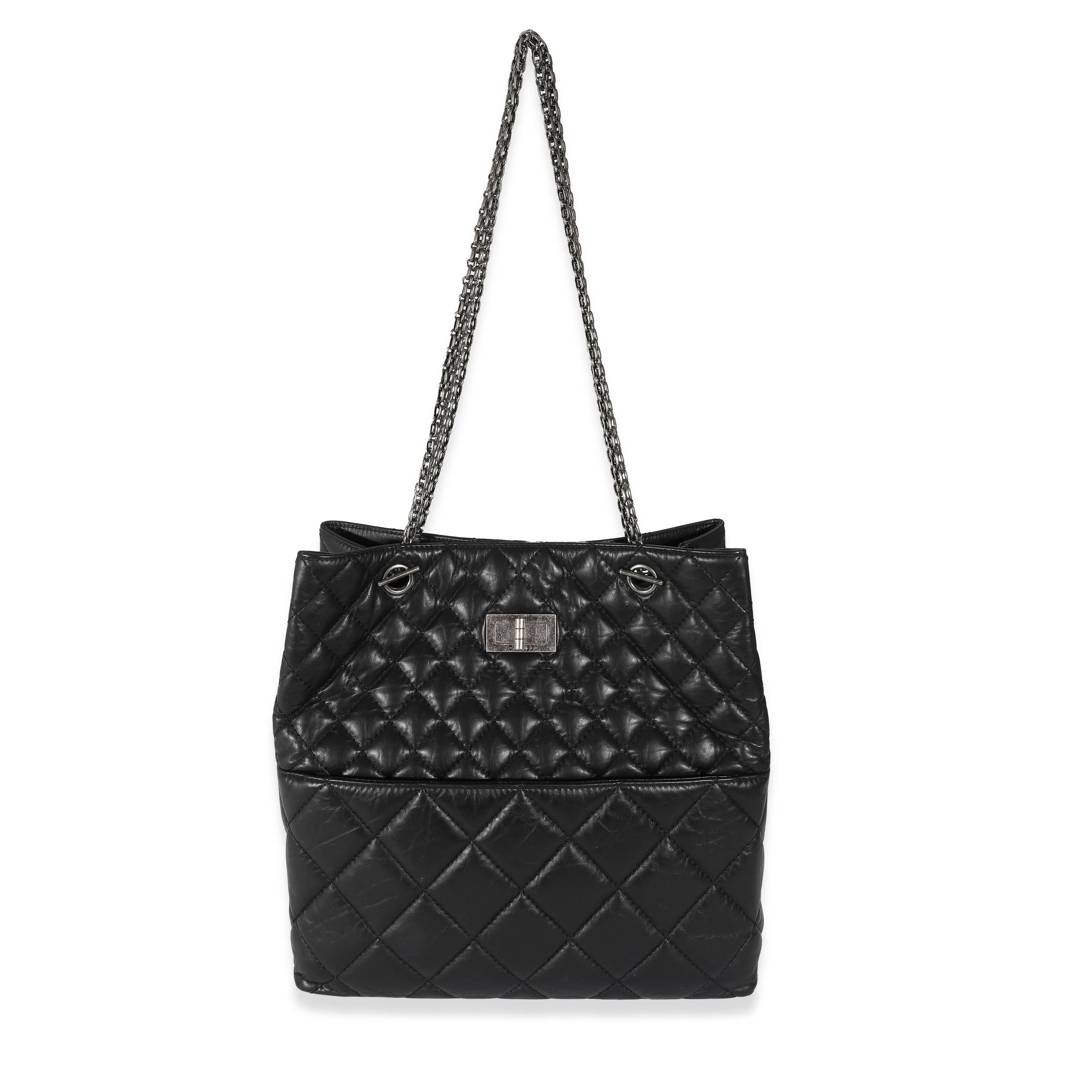 Listing Title: Chanel Black Calfskin Tall 2.55 Reissue Tote
SKU: 132526
Condition: Pre-owned 
Handbag Condition: Very Good
Condition Comments: Item is in very good condition with minor signs of wear.  Exterior scuffing, marks and light indentation.