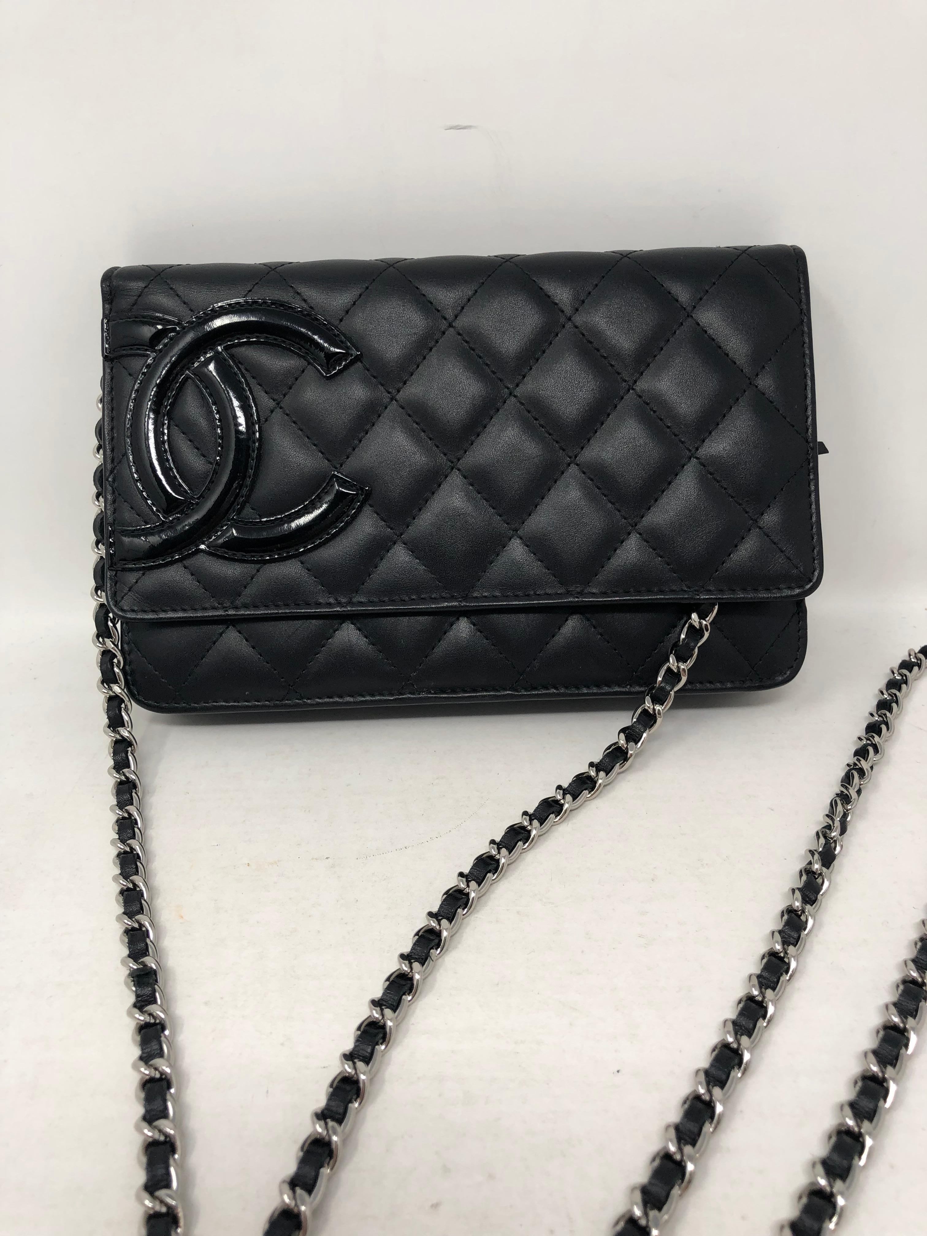 Chanel Cambon Black Wallet On A Chain. Silver hardware. Can be worn as a clutch or a crossbody. Mint condition. Guaranteed authentic. 