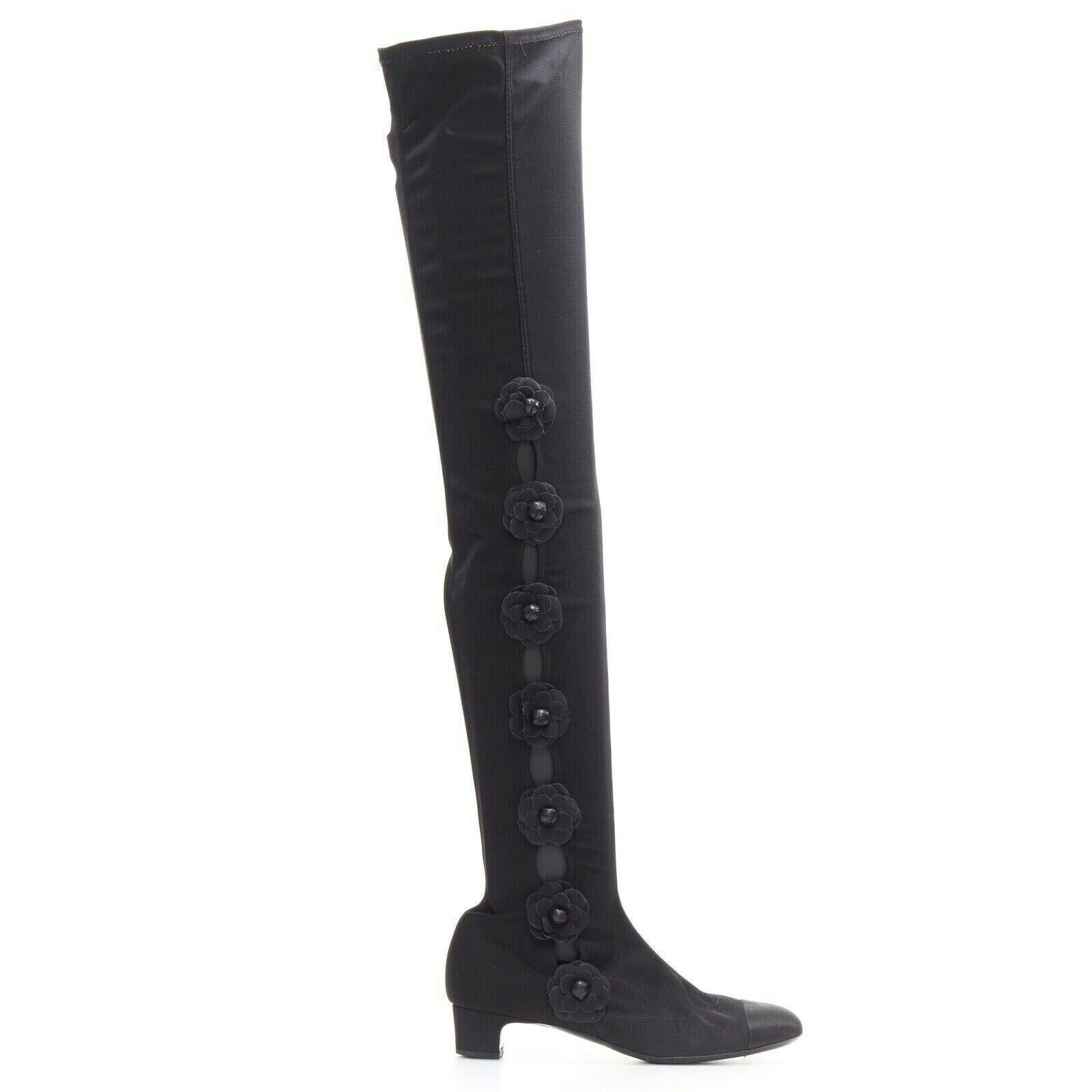 CHANEL black Camellia applique satin toe cap stretch fit flat knee boots EU38.5

CHANELBlack stretch fabric upper. Satin toe cap. Tonal stitching. Signature Camellia leather bud floral applique. Block short heel. Stretch fit. Knee high boot. Made in