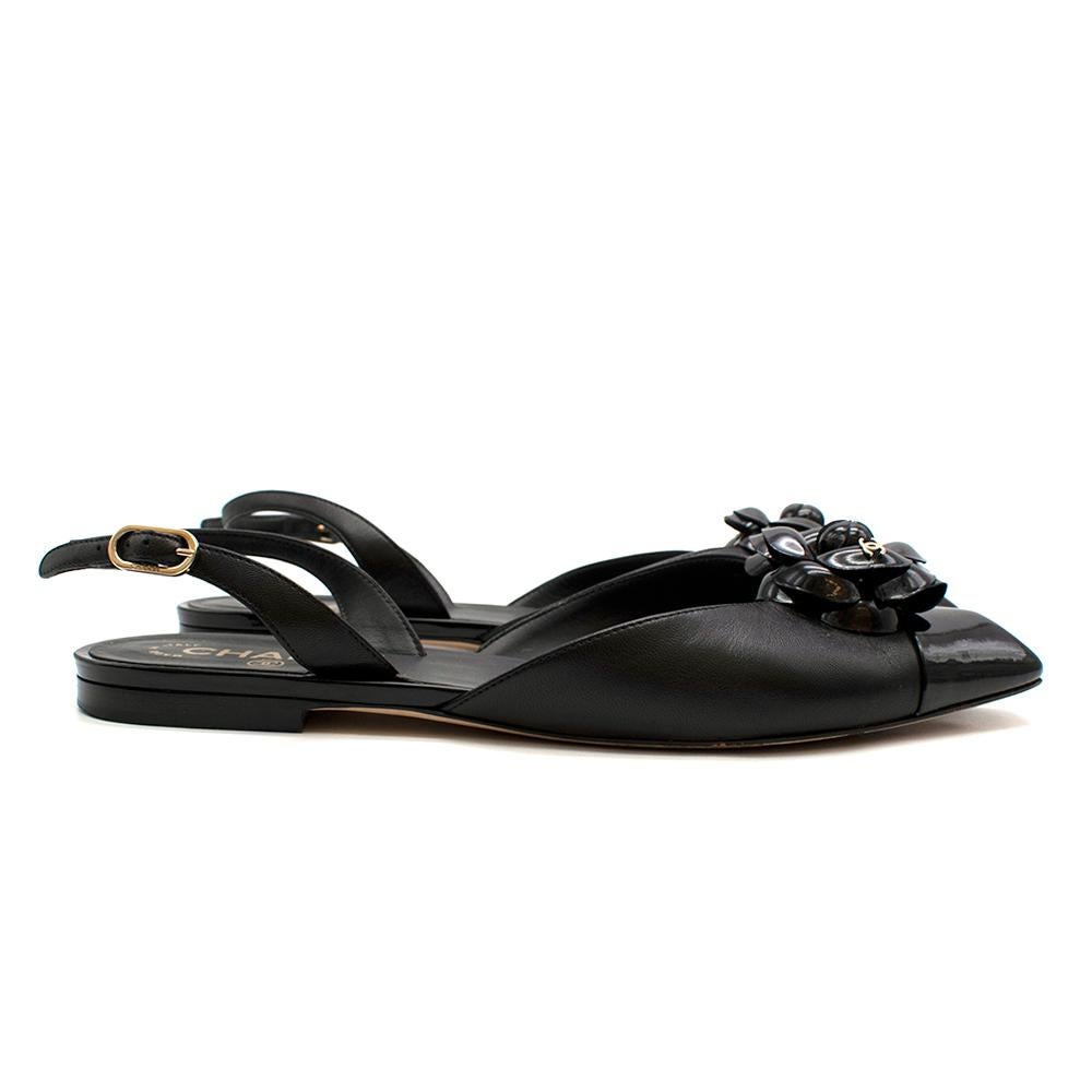Chanel Black Camellia Embellished Slingback Leather Flats
-Chic and timeless slingback  flat
-Stunning patent signature Camellia embellishment with iconic CC logo detail
-Squared black patent cap toe
-Branded metal adjustable buckles
-Flat square