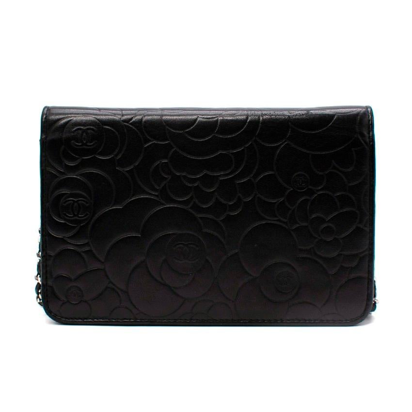 Chanel Black Camellia Floral Embossed Leather Wallet On Chain

- Supple black lambskin leather embossed with signature Camellia floral pattern with CC logo in the centre of each bloom
- Silver-tone hardware finish
- - CC snap button closure
- Chain