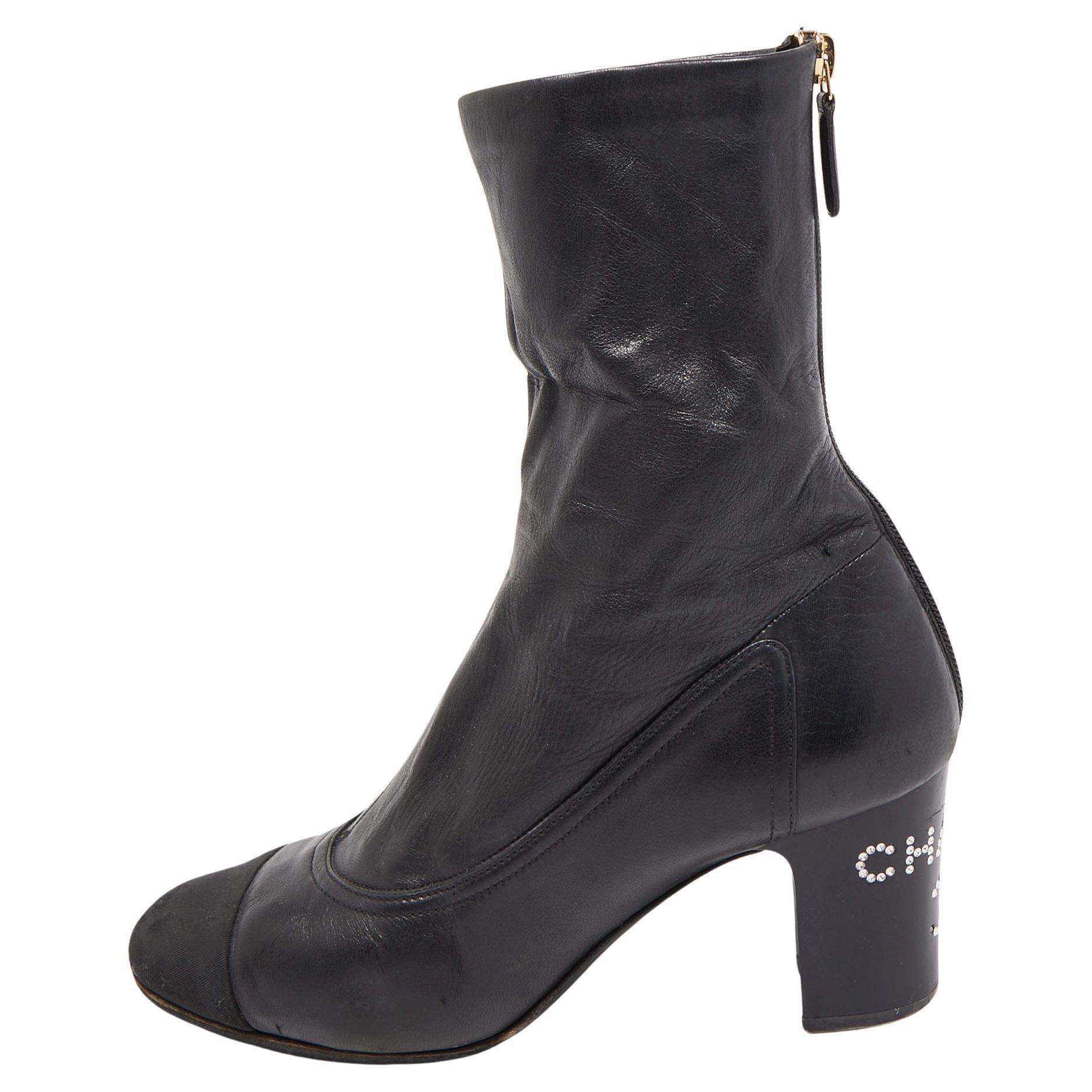 Chanel Black Canvas and Leather CC Cap Toe Ankle Boots  For Sale