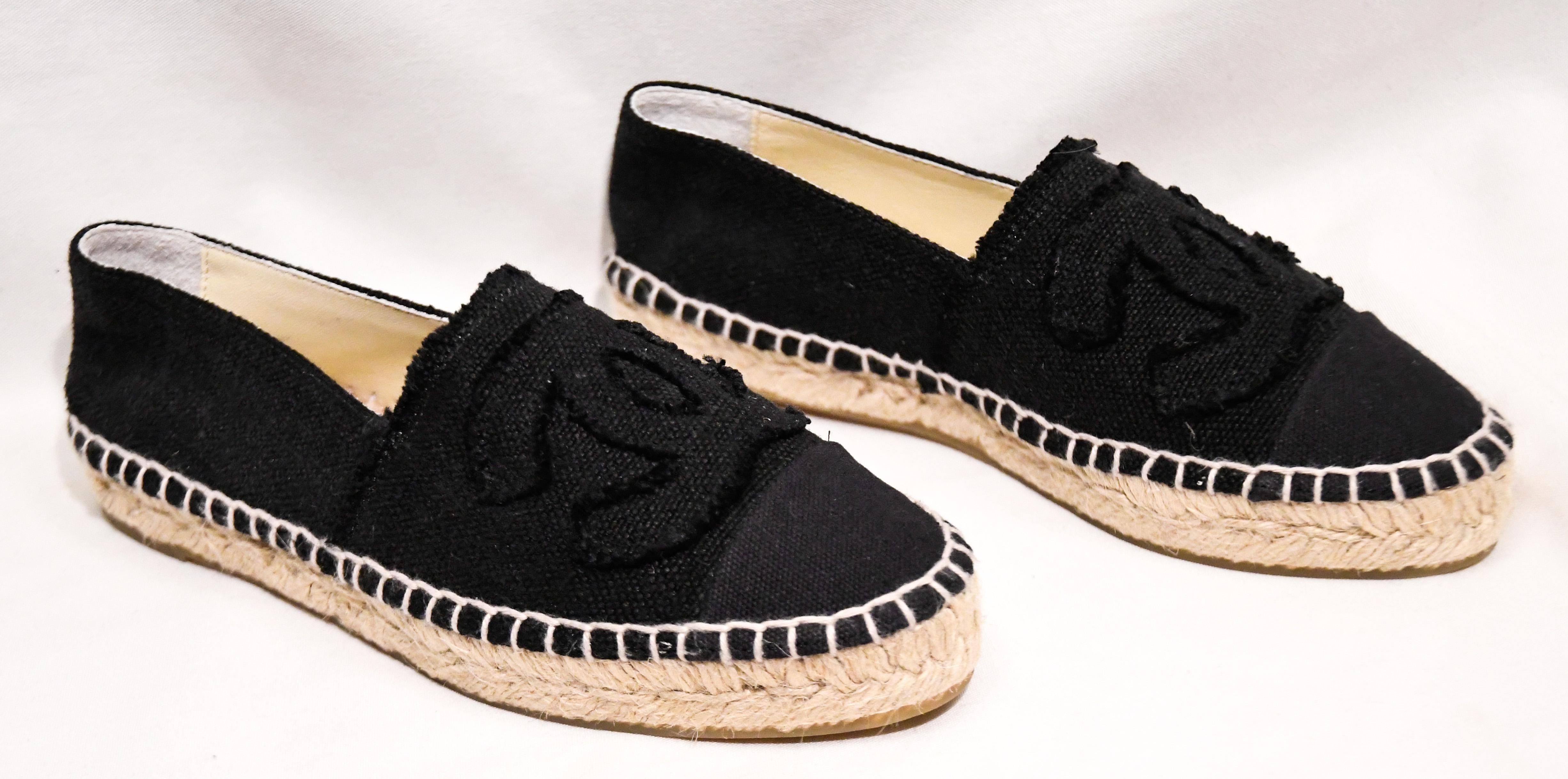 Chanel black linen canvas espadrille flats can enhance any style. These highly sought after espadrilles from Spring 2014, are a must have for any trendy fashionista! These flats include the signature woven rope Espadrille style and a large CC