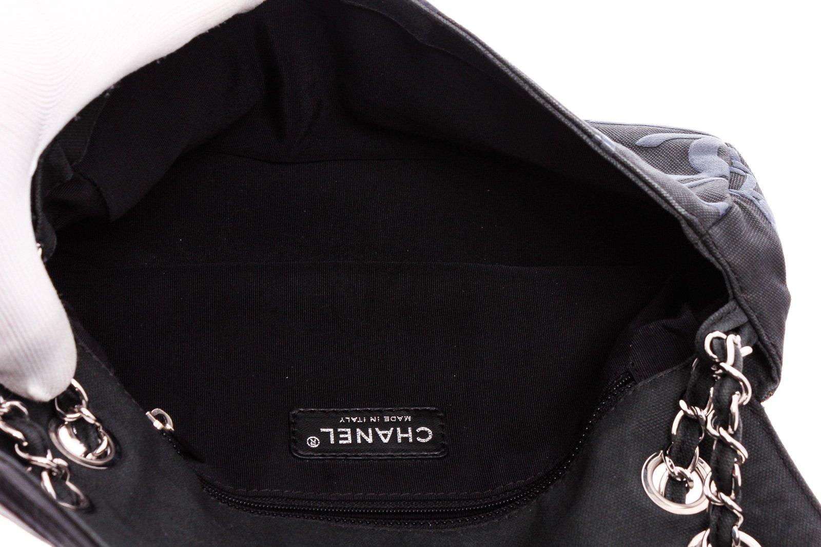 Chanel Black Canvas White Leather Trim Camellia Embossed Flap Shoulder Bag In Good Condition In Irvine, CA