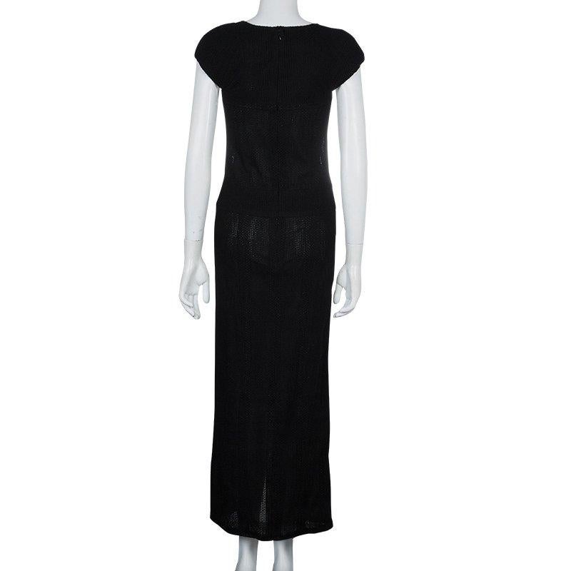 This alluring and gorgeous black Maxi dress from Chanel will offer you a winsome look. Crafted from cotton. It features a laudable neckline and adorable cap sleeves to count on. This dress is accentuated with a rear zipper.

