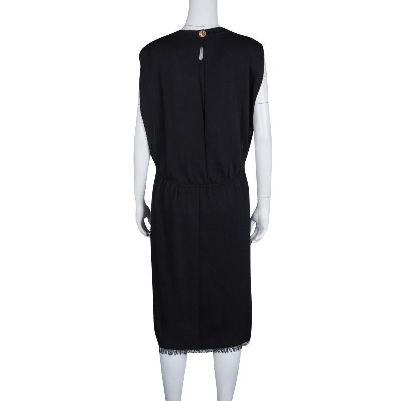Dress it up for the sleek formal events or wear it to the parties, this stunning Chanel dress set is a versatile piece to add to your collection. Constructed in black cashmere fabric, this 2 piece set features simple sleeveless dress with a top