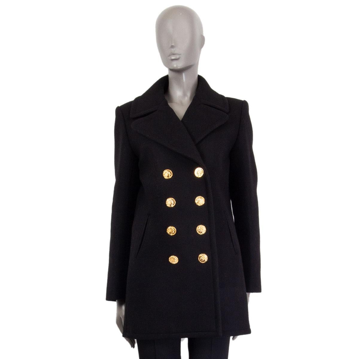 100% authentic Chanel Rome double-breasted Pea-Coat from the Pre-Fall 2016 Métiers d'Art Collection   in black cashmere (96%) and wool (4%) with notched lapels, structured shoulders and three buttoned sleeves-hem. Closes with four gold-tone