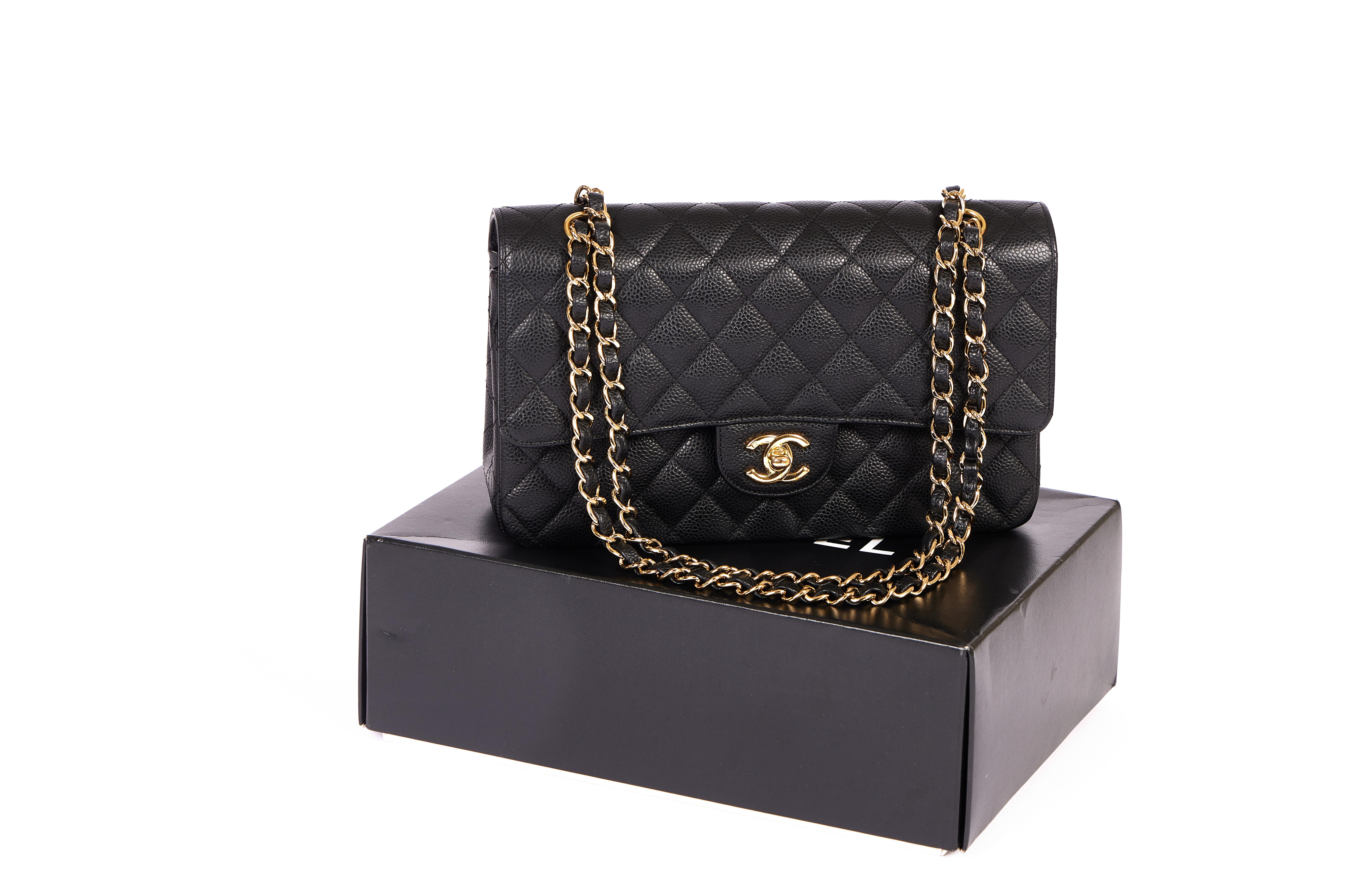 This classic Chanel Caviar double flap comes in black with the golden chain and the double CC logo in front. It's the perfect cross body bag and made for every occasion. This bag comes with a Chanel box, the booklet and inventory card. The hologram