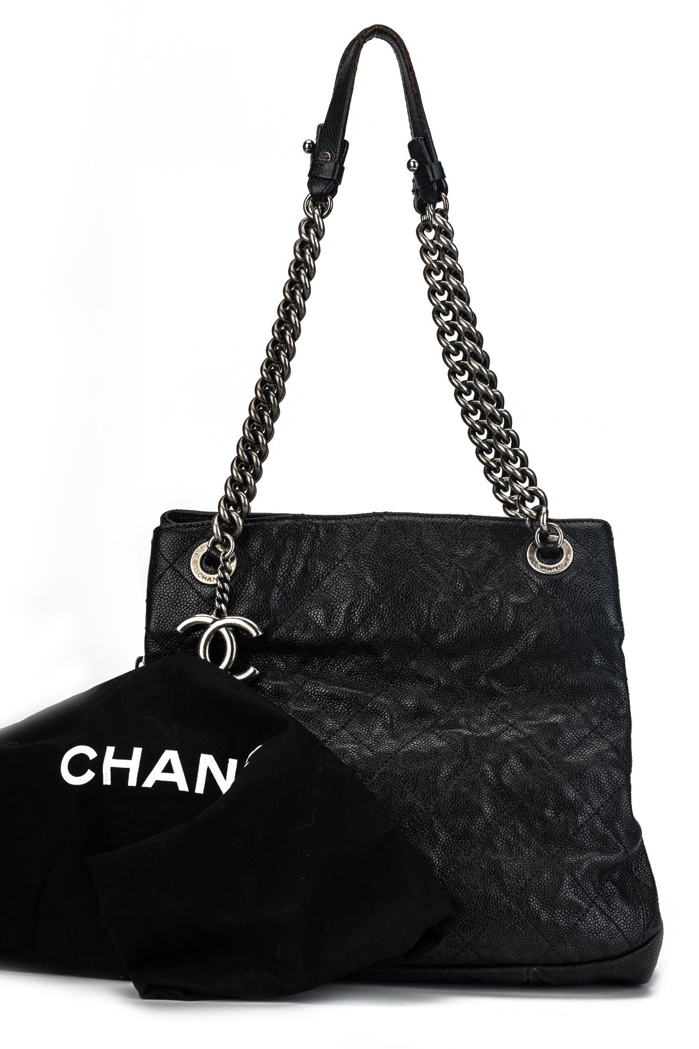 Chanel black caviar lambskin leather with silver tone hardware. Shoulder drop 10