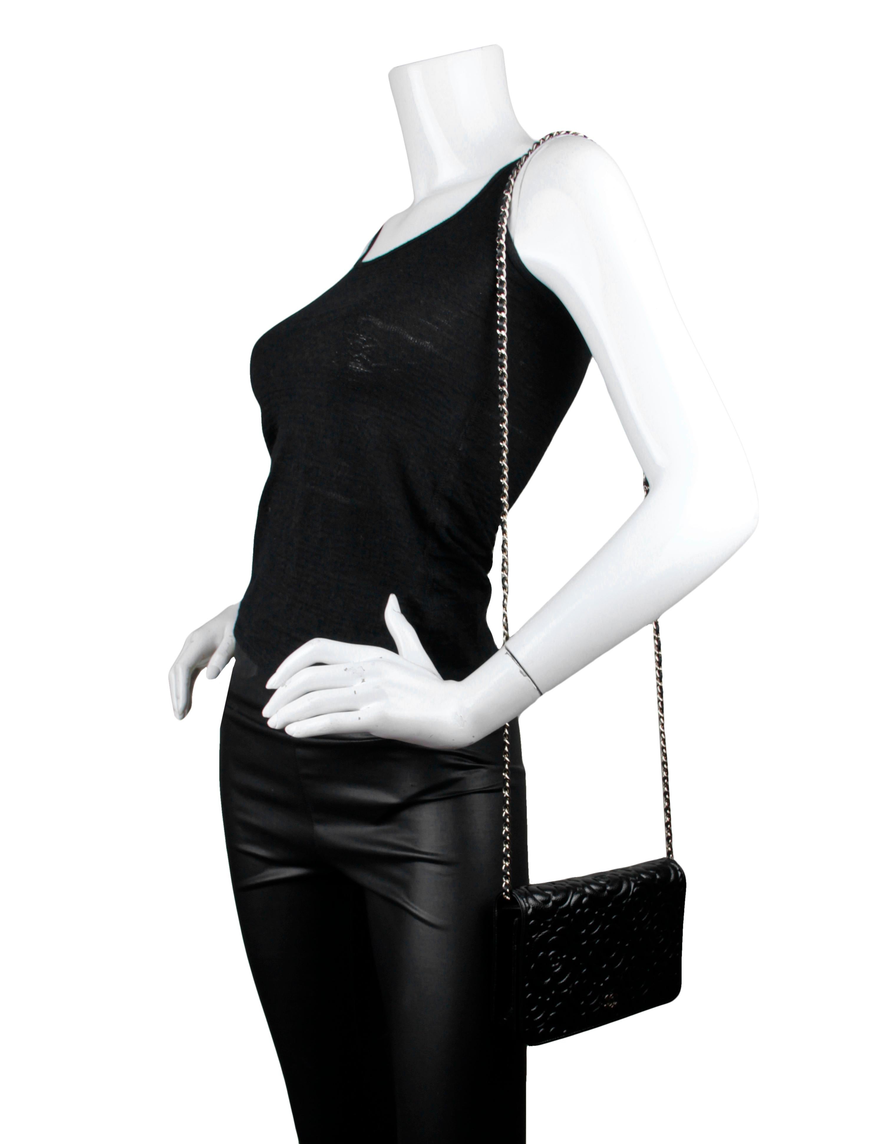 Chanel Black Caviar Leather Camellia Embossed Wallet on Chain WOC Crossbody Bag.  Chain can be tucked inside bag to also be worn as a clutch. 

Made In: Italy
Year of Production: 2020
Color: Black
Hardware: Pale goldtone
Materials: Caviar