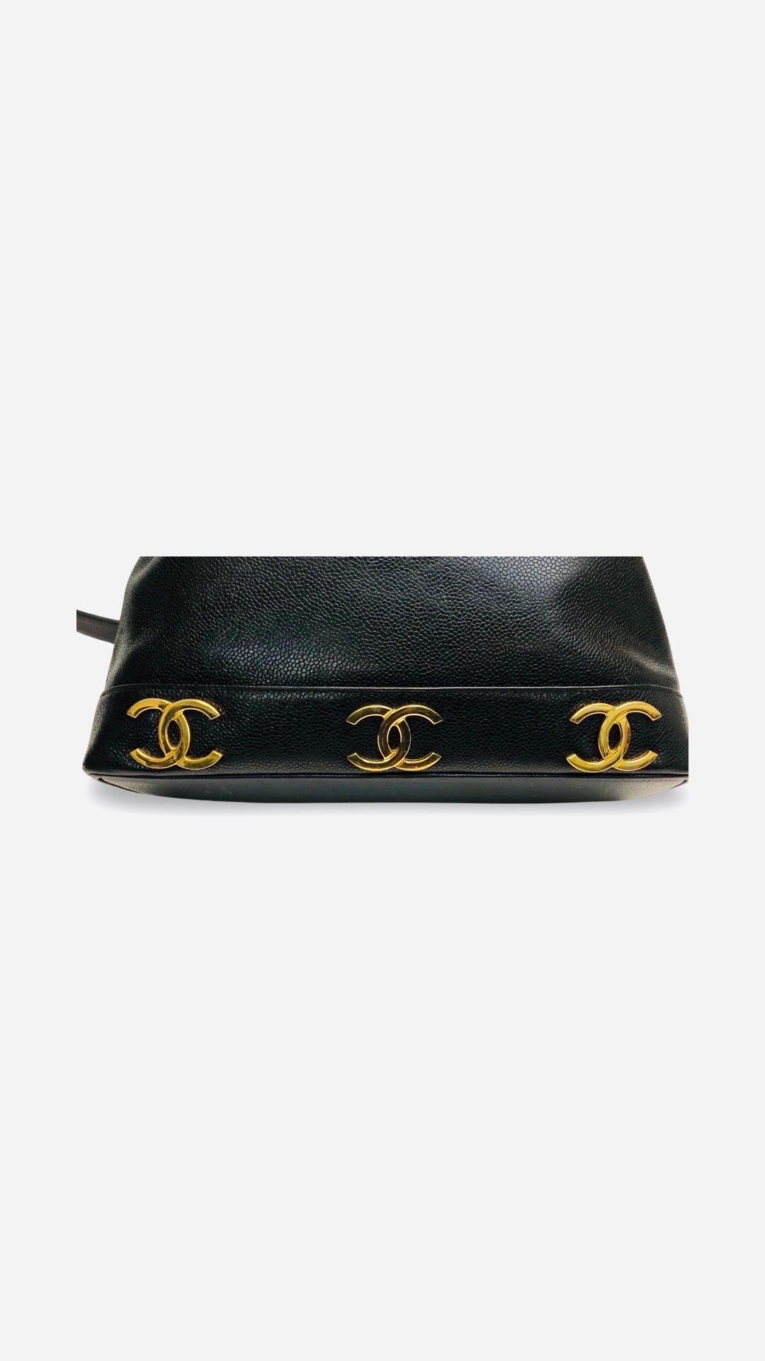 - Vintage 90s Chanel black caviar drawstring bucket bag. 

- Six CC gold toned hardware on both sides at the bottom. 

- CC gold ball. 

- This bag does not come with an original pouch.  

- Length: 30cm. Height: 30cm. Width: 9.5 cm. Strap Drop: