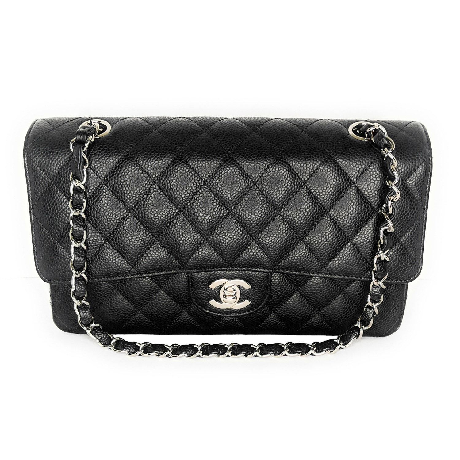 This shoulder bag is crafted of luxurious diamond-quilted caviar leather in black. The bag features a rear patch pocket, a leather-threaded polished silver chain link shoulder strap, and a matching silver classic CC turn lock on the crossover flap.