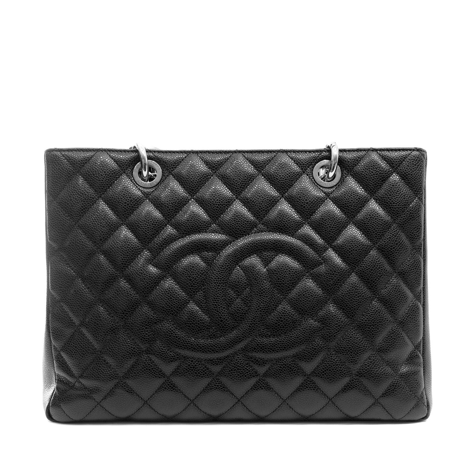 This authentic Chanel Black Caviar GST is in pristine condition. Part of the Timeless Classics collection, the Grand Shopping Tote, or GST, is a go anywhere year-round piece. 

Durable textured black caviar leather is quilted in signature Chanel