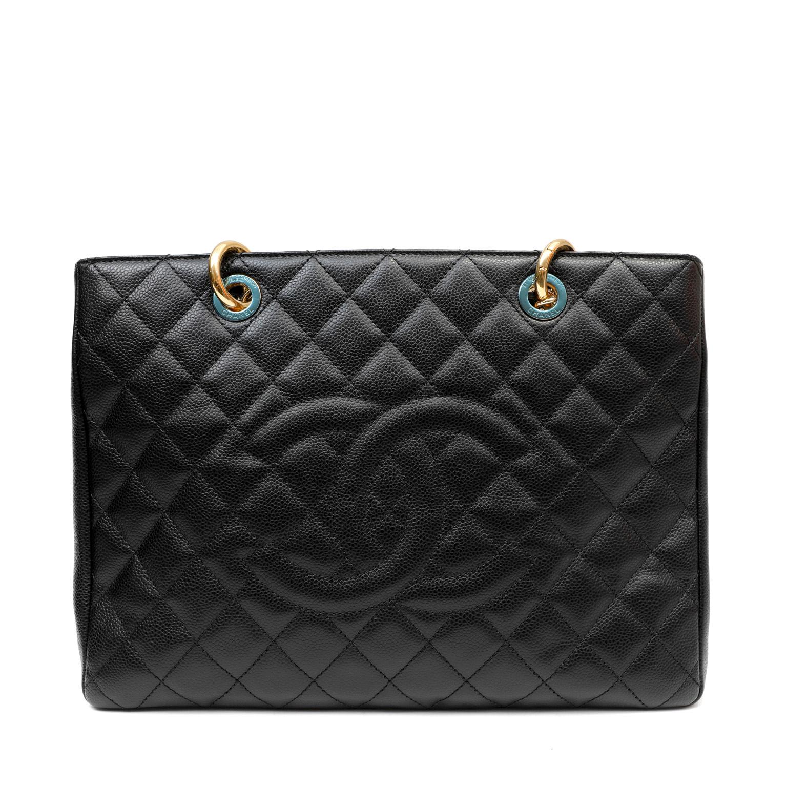 This authentic Chanel Black Caviar Grand Shopping Tote is in pristine unworn condition.  The beloved GST is from the Timeless Classics Collection and is a versatile accompaniment to any ensemble. 
Textured and durable black caviar leather is quilted